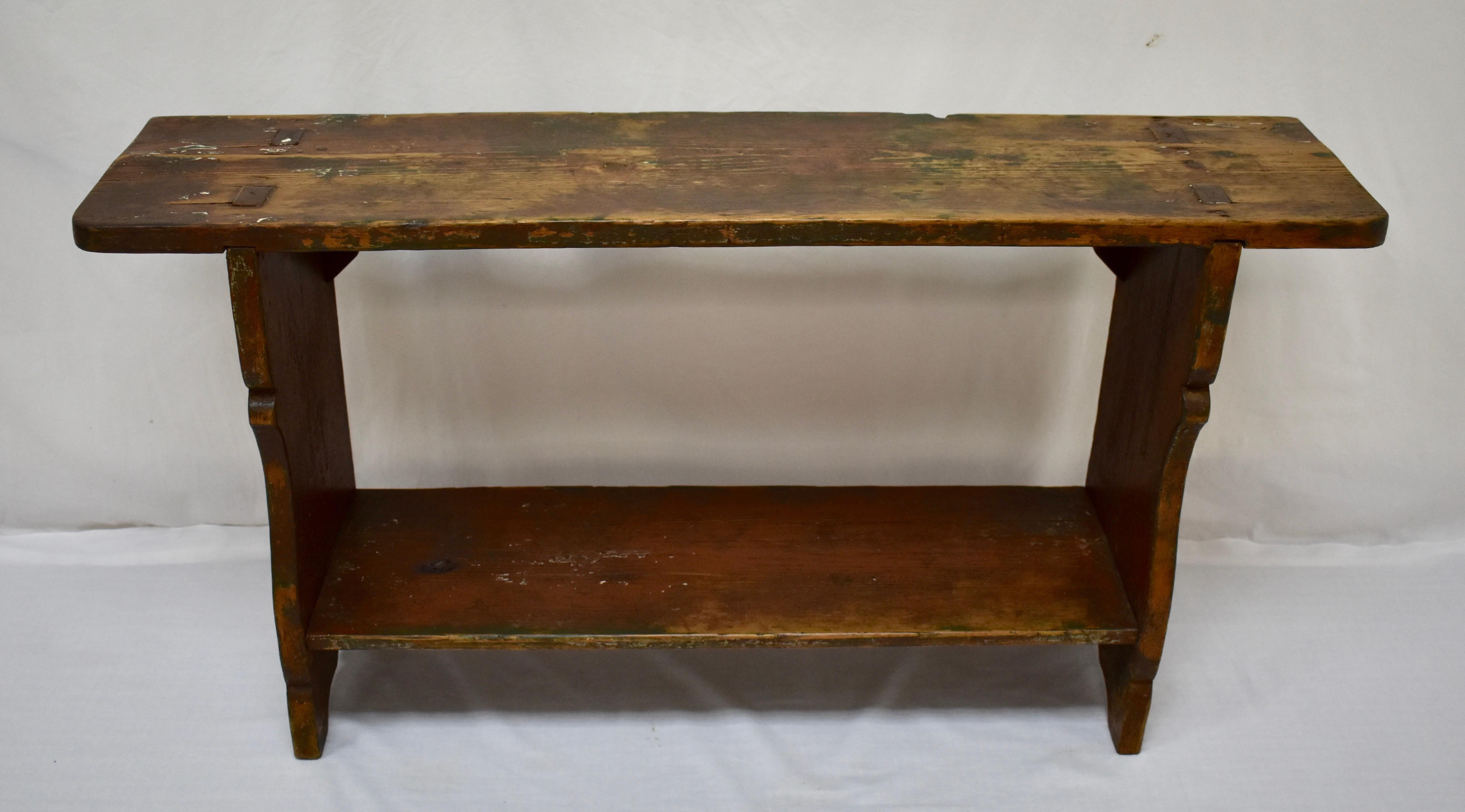 This little bench had to be sturdy to bear the large vessels that were stored upon it and have left their imprint on its surfaces. So, the bottom shelf is dovetailed into the sides which are dovetailed and through-tenoned into the top. An original