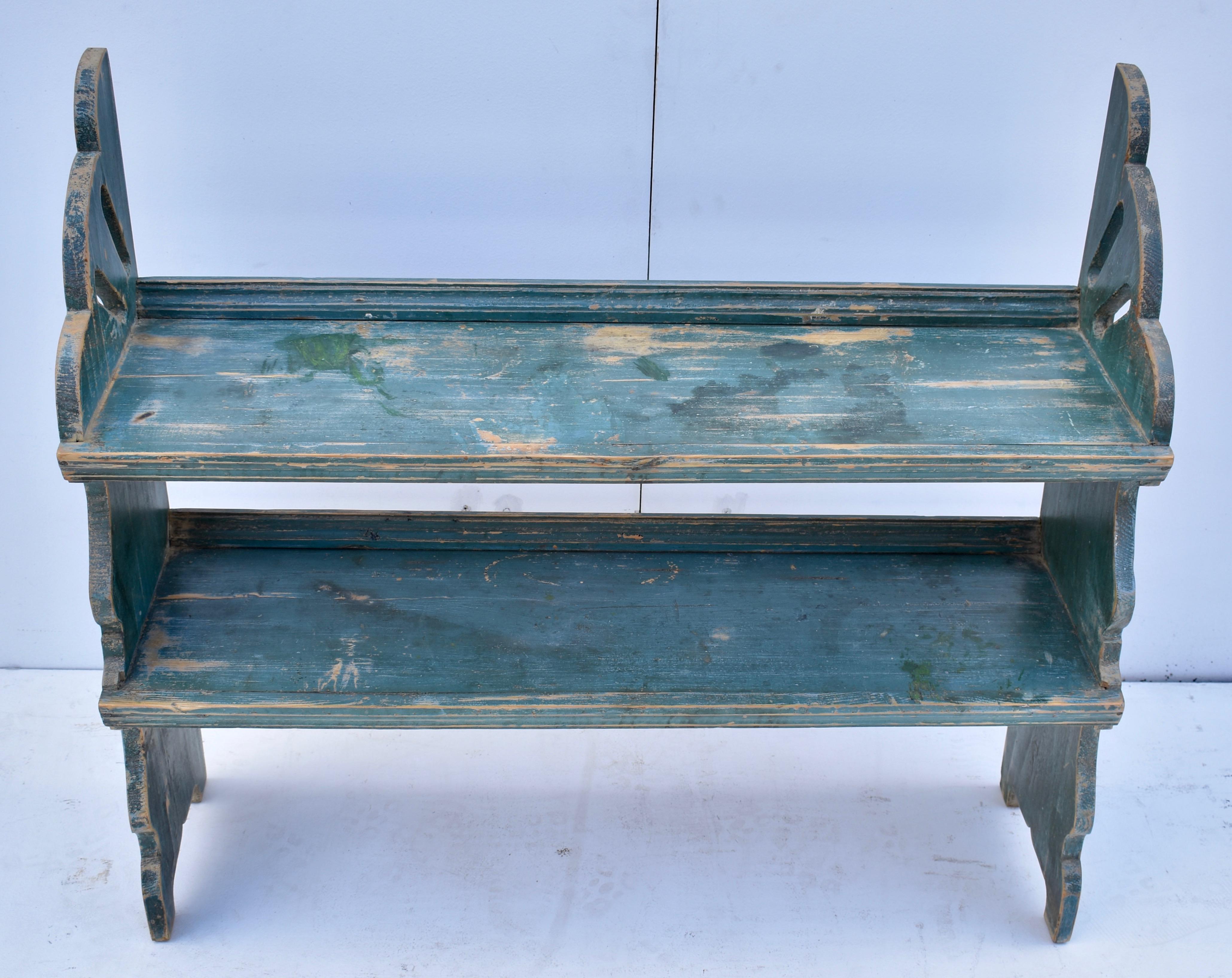 This interesting and attractive water bench has scalloped sides with fretwork perforations at the top. The two shelves are tenoned through the sides for strength and stability and a lip at the back prevents vessels from falling off. Built to house