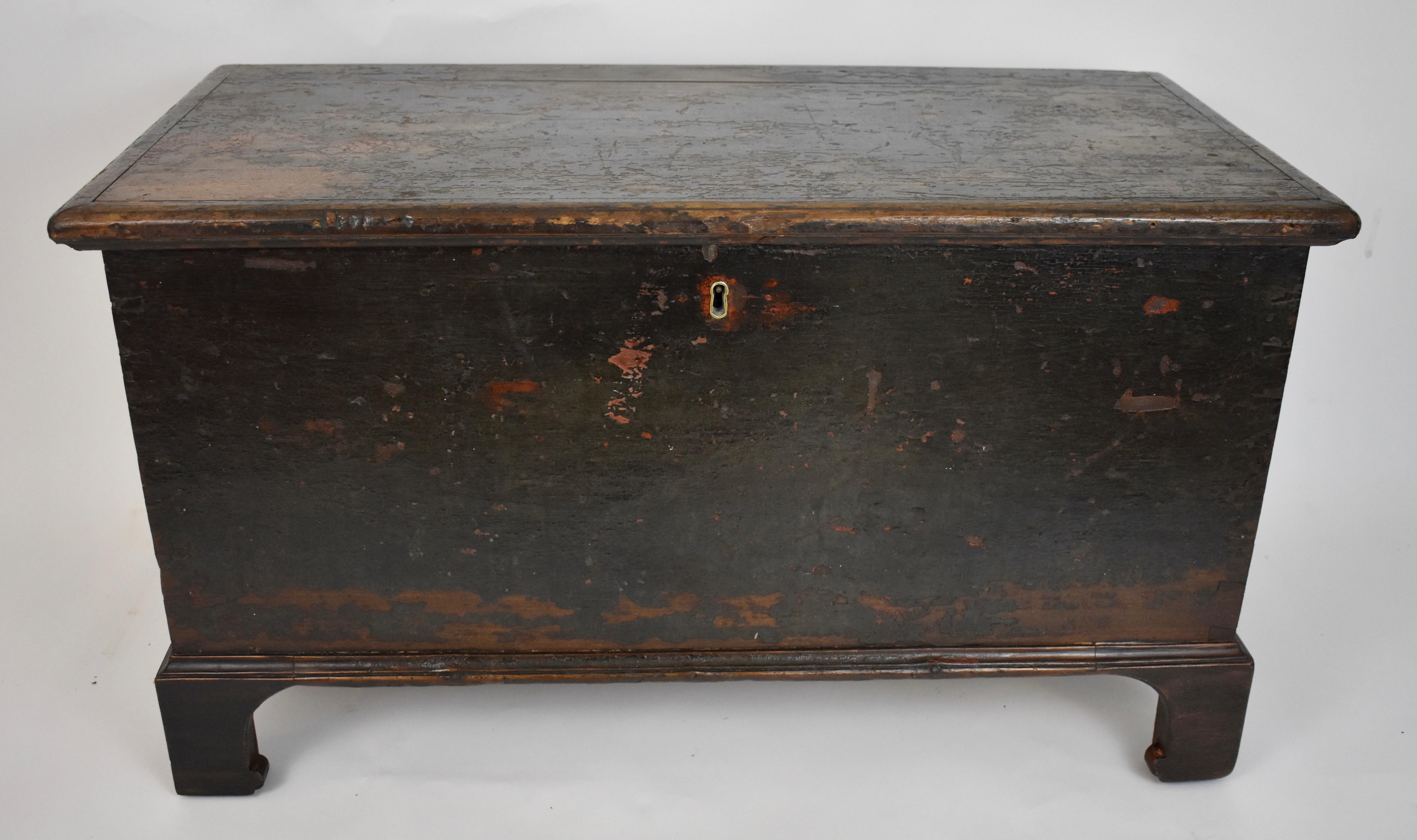 This pretty little poplar chest has developed a lovely patina with dark paint worn through to pumpkin orange and what looks like the remains of decorative floral work and to bare wood in places. The result is very attractive. The chest itself is