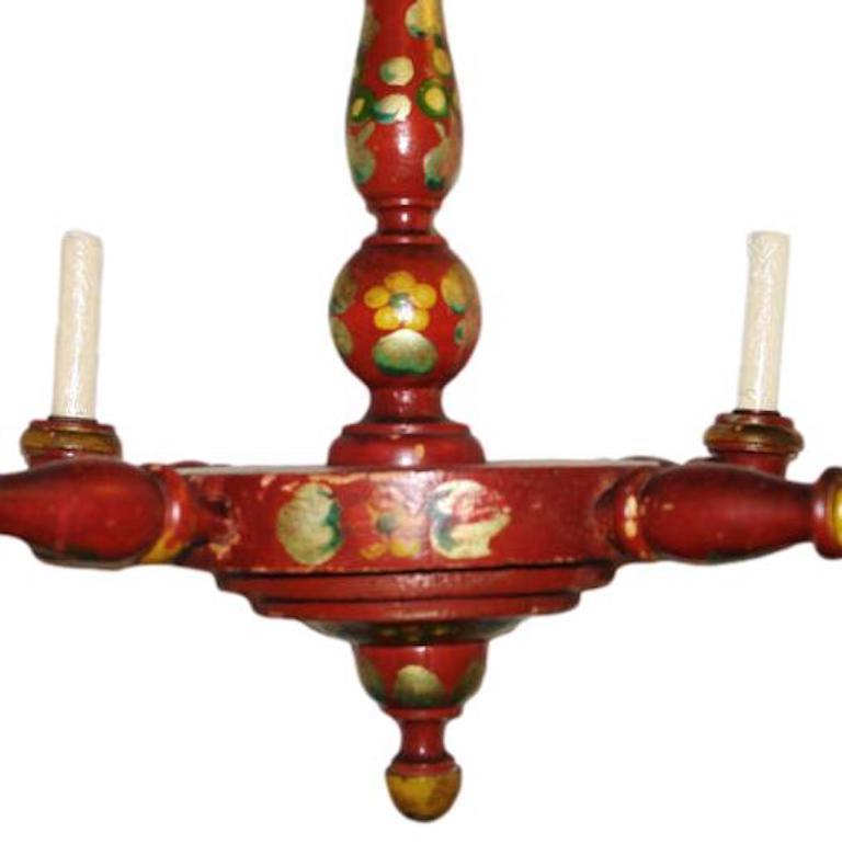 Circa 1930's English painted wood chandelier with floral decoration and original finish.

Measurements:
Height: 25