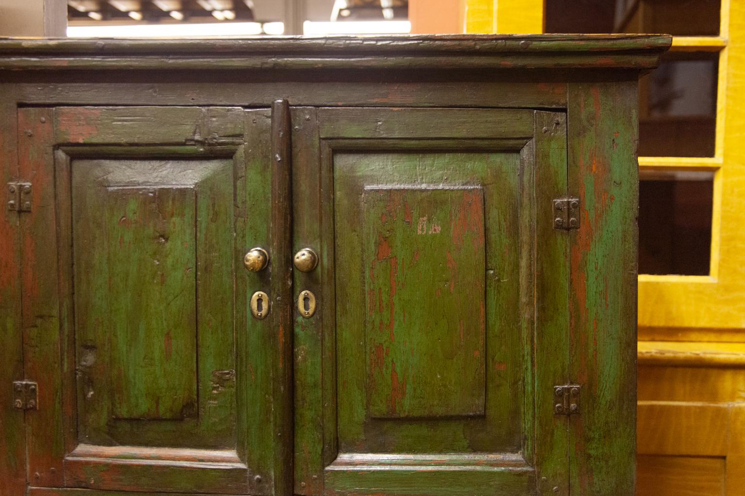 Painted Russian painted step back cupboard, with raised panels in the top section, exposed double peg construction.