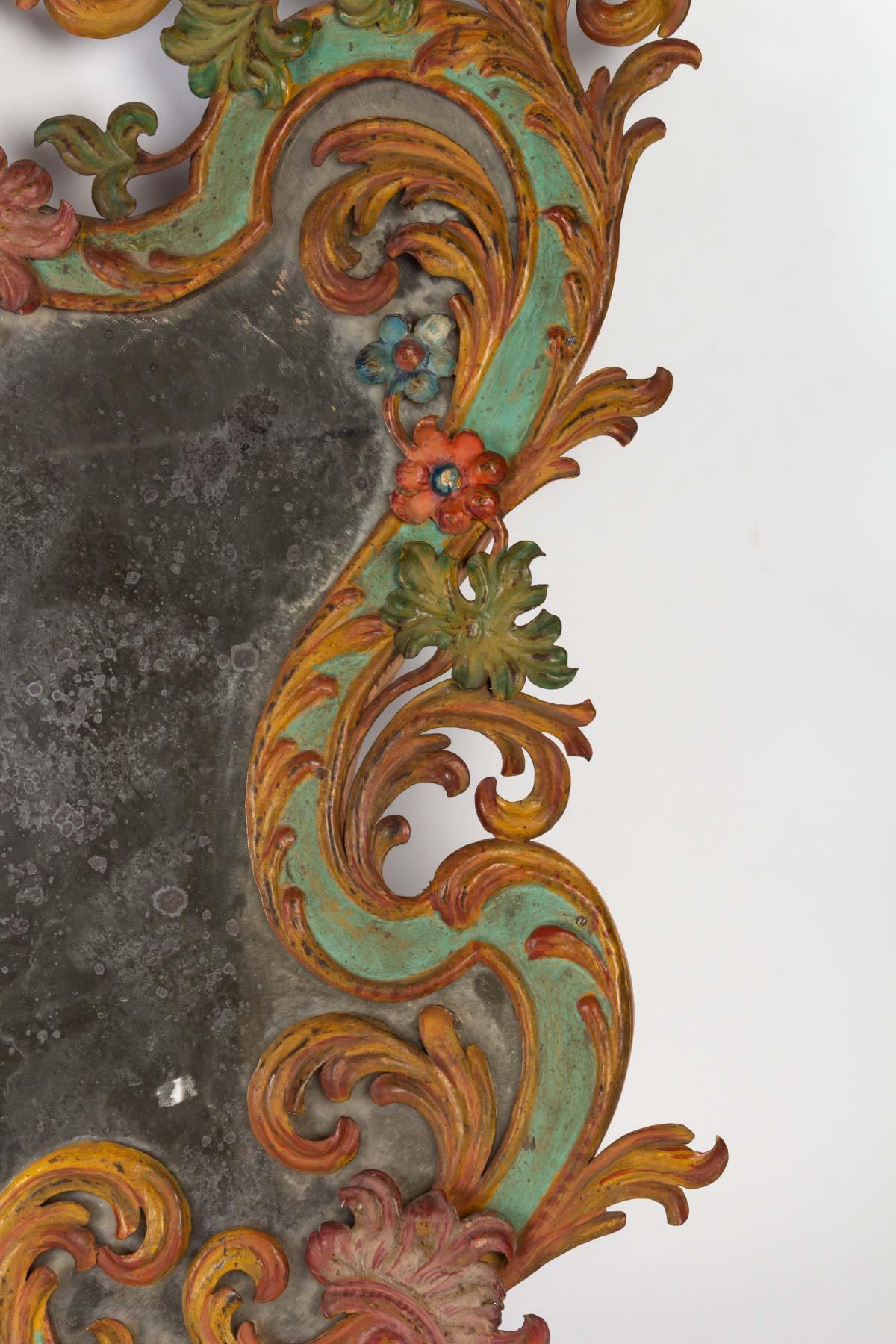 Painted sheet metal mirror, Italy, late 19th century
Measures: H 70cm, W 58cm, D 11cm.