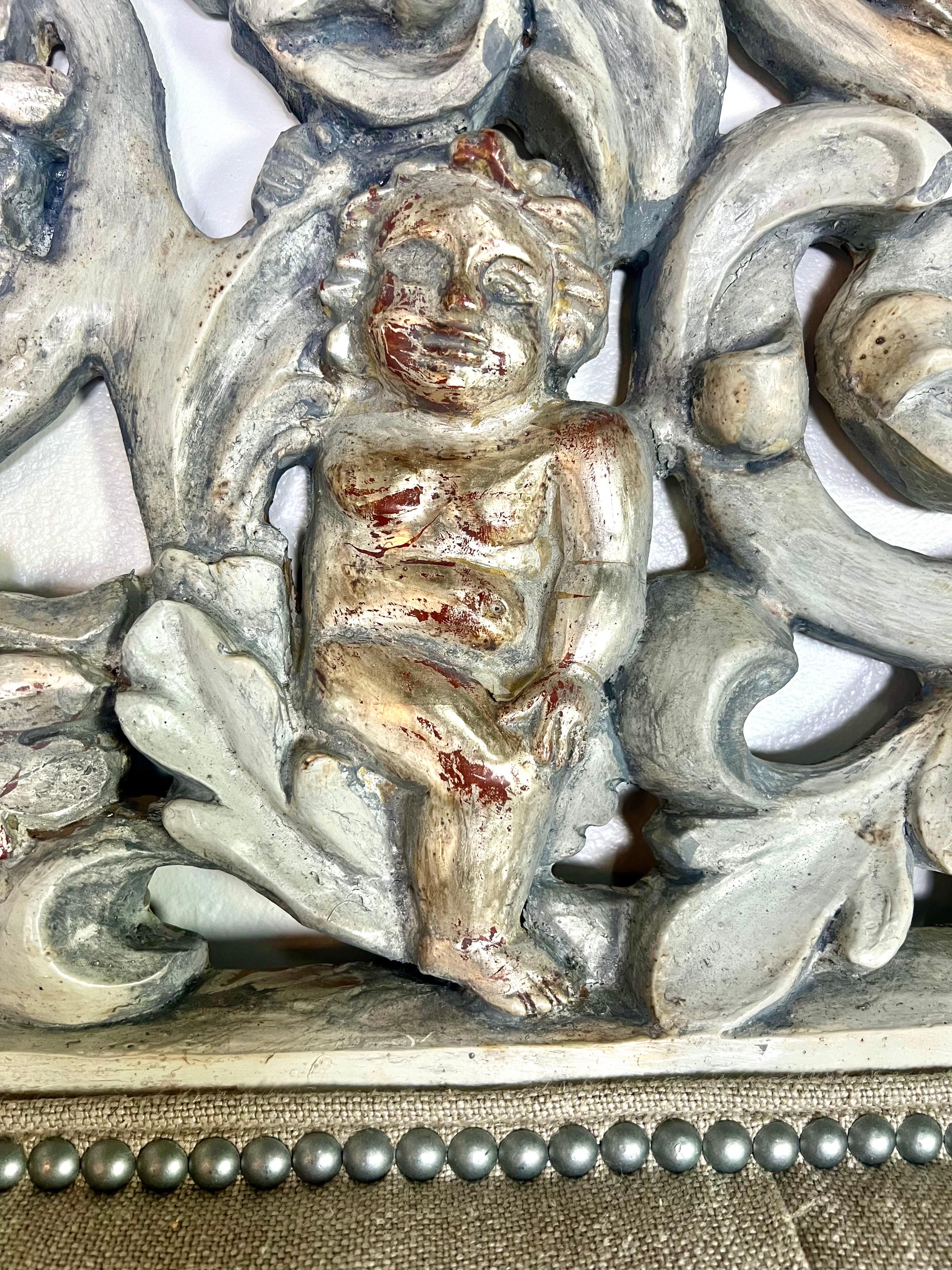 Hand-Carved Painted & Silvered Carved Cherub Linen Headboard For Sale