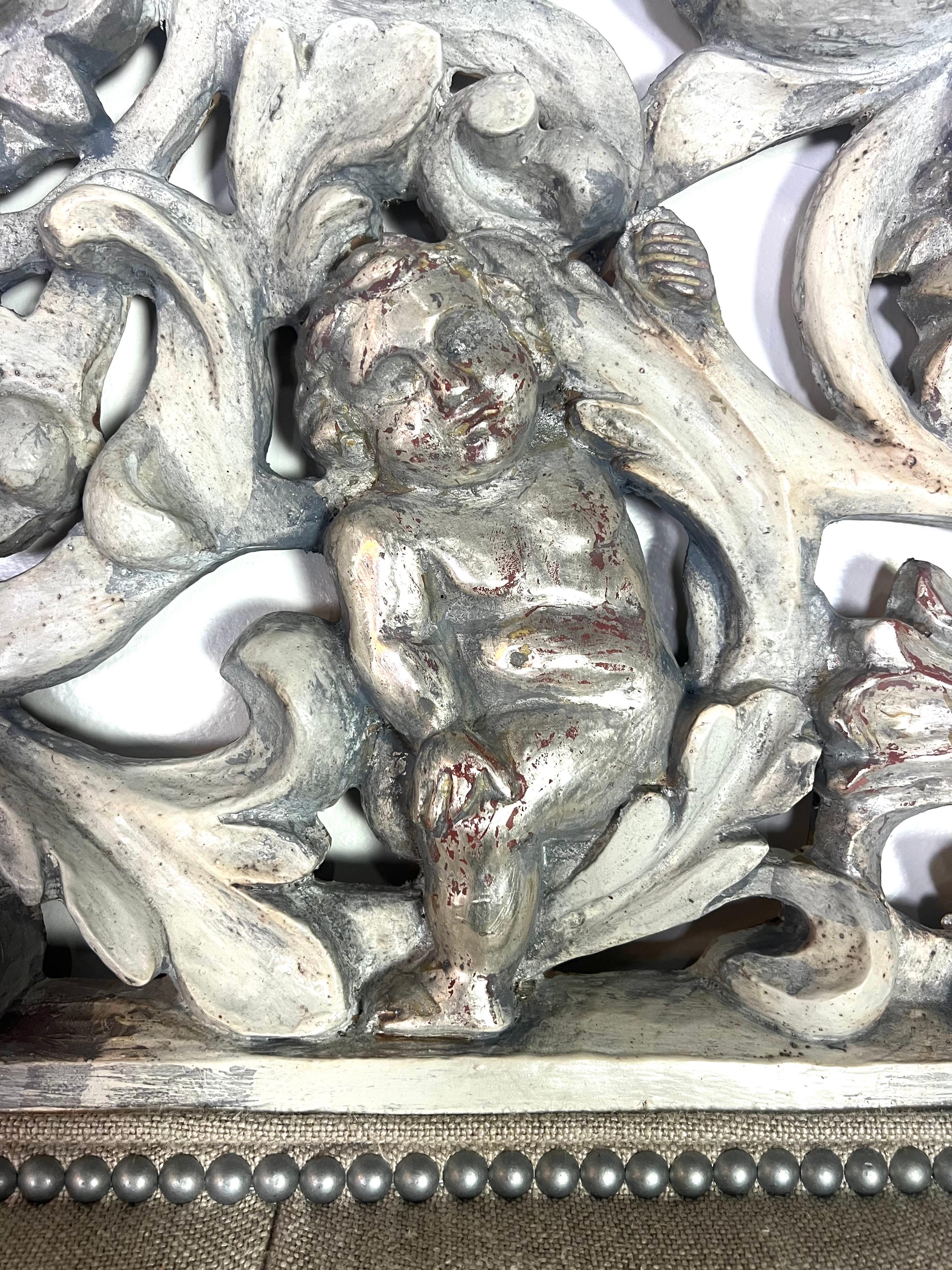 Painted & Silvered Carved Cherub Linen Headboard In Excellent Condition For Sale In Los Angeles, CA