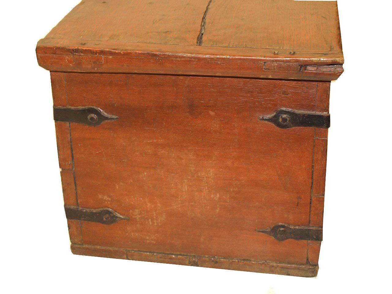 Painted steel bound trunk, with hand wrought steel straps on all sides, open interior with candle box on right, original steel hinges. The top has ''bread board'' ends and a shrinkage crack ( see photo ) on the left side. Original steel escutcheon.