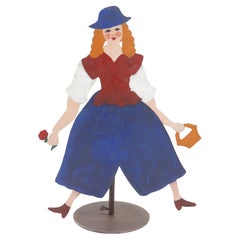 Parafuoco in acciaio dipinto raffigurante una fanciulla in fiore su supporto, C.C. 1940