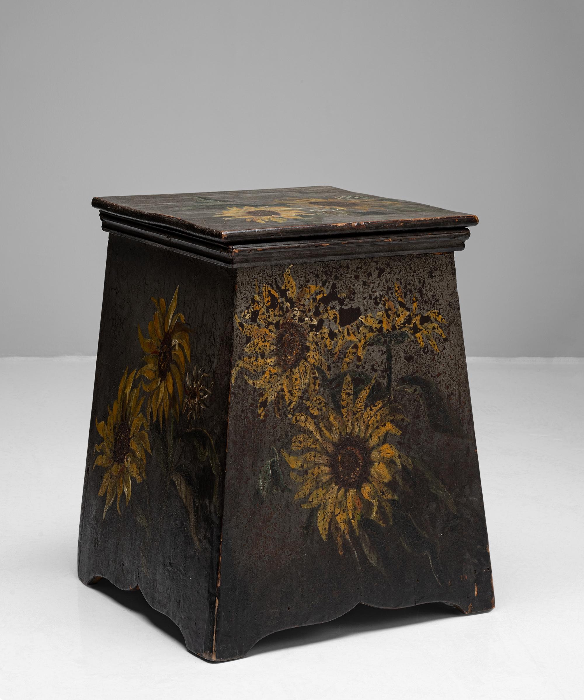 Painted sunflowers stool / end table
France, circa 1880

Original worn hand painted surface with space for storage.

Measures: 14.5” W X 13.25” D X 20.25” H.