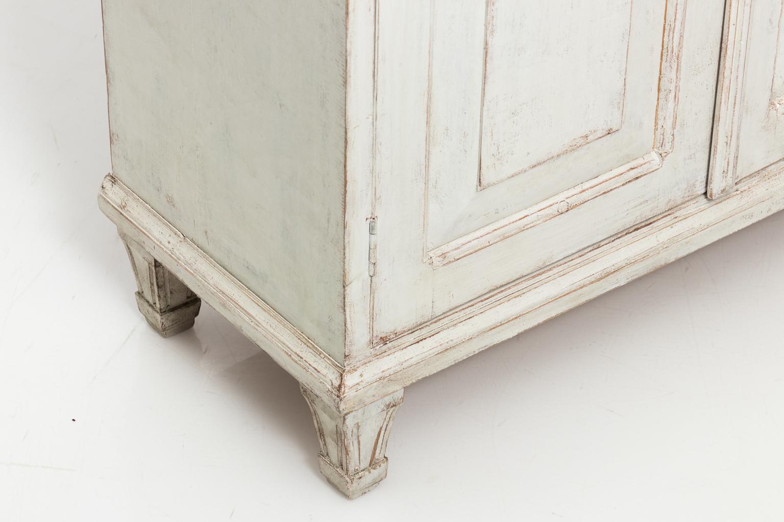 Swedish painted buffet table with four doors and drawers, circa 1860s. The piece comes with a working lock and key.