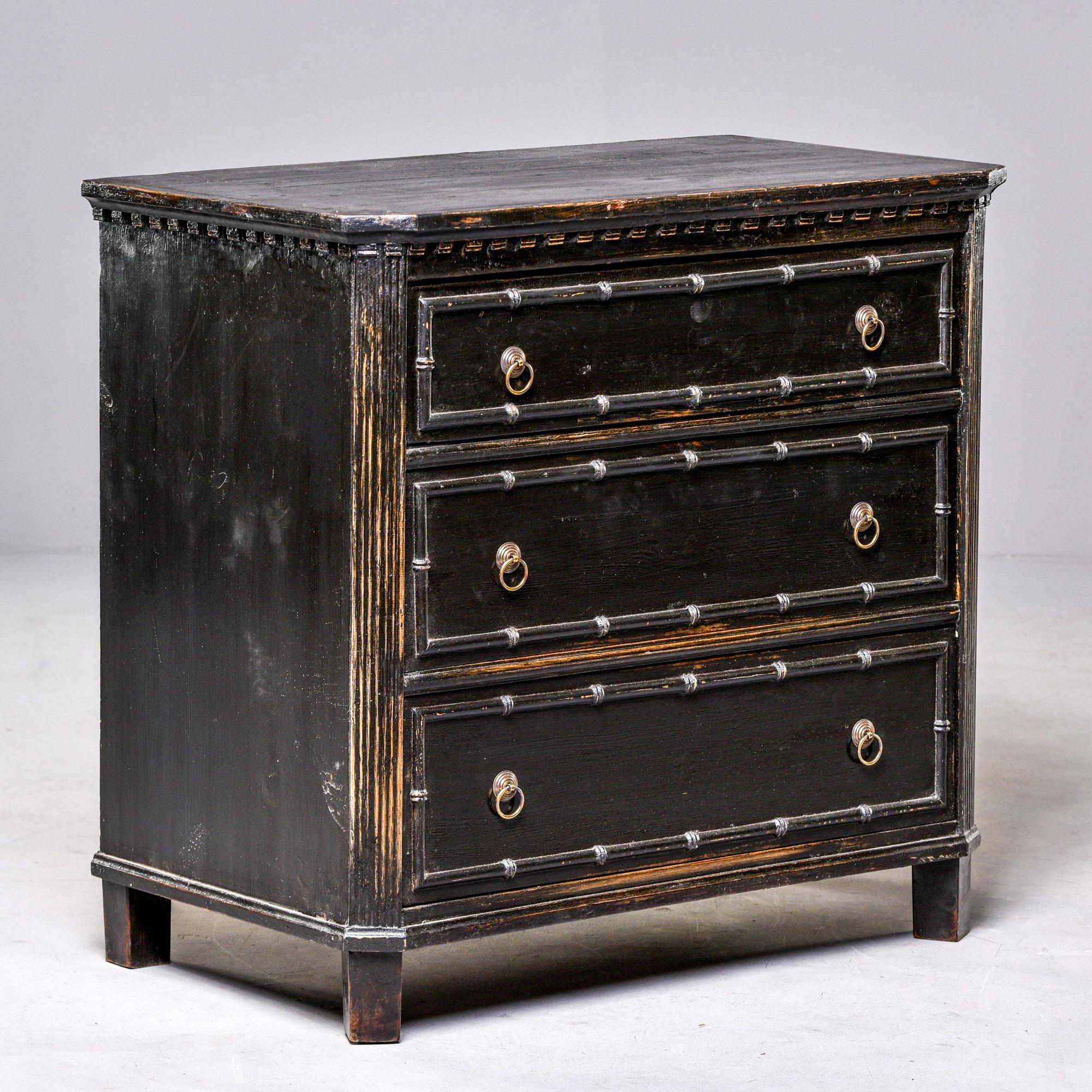 Preowned three-drawer Swedish style chest with distressed black painted finish and faux bamboo details. Brass ring pull hardware, dovetail construction. Unknown maker, found in England. Versatile size and style.


  