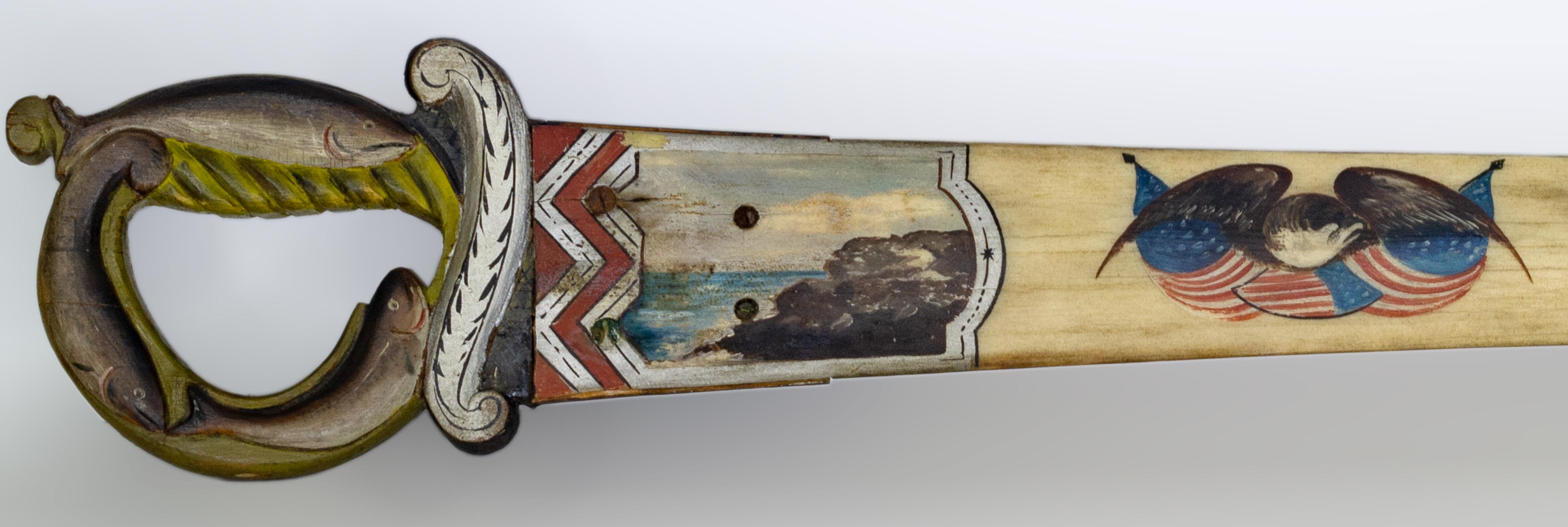 The hilt is painted and relief carved with three fish, and the bill has four vignettes with an eagle, rocky shoreline, swordfish and American shield. The back side is signed and dated 