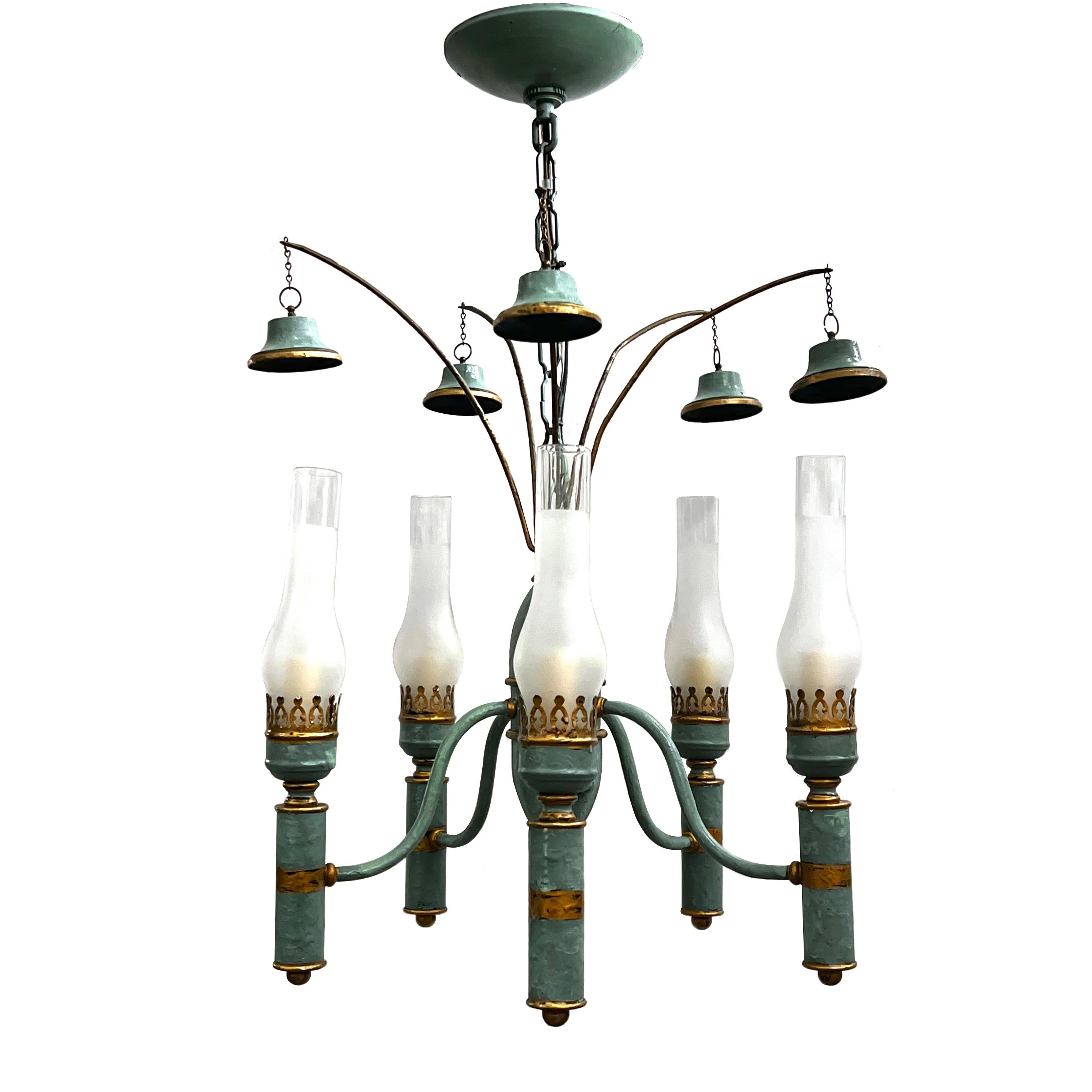 A circa 1920s French painted and gilt tole chandelier.

Measurements:
Drop: 25