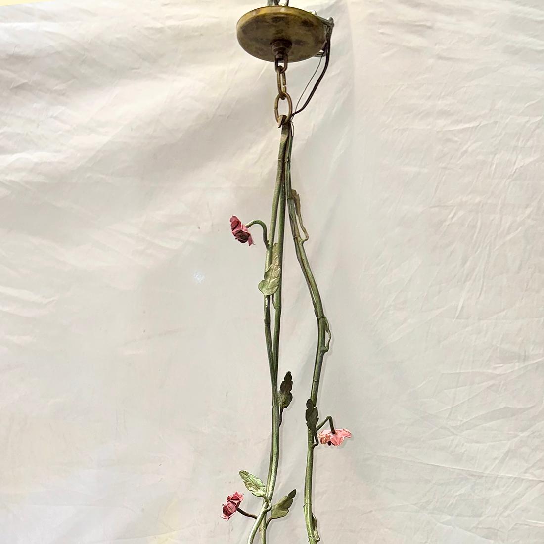 A circa 1920's Italian chandelier with foliage motif and 6 candelabra lights.

Measurements:
Drop: 36