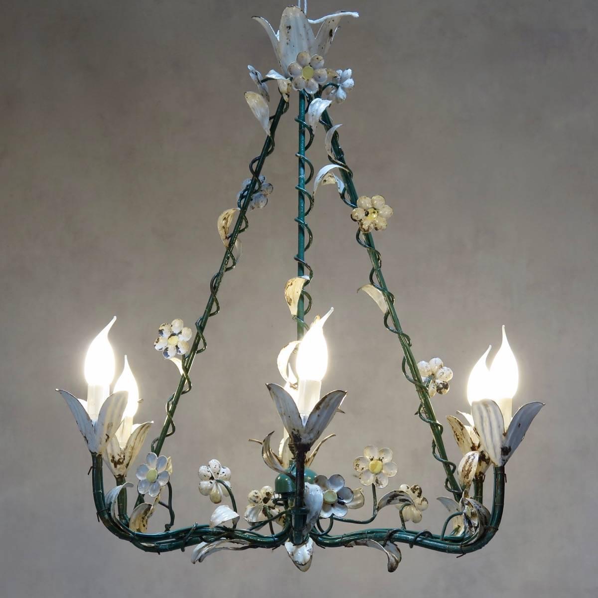 Charming 1940s painted iron chandelier with six lights. Decorated with climbing, vine-like foliage, daisies and lillies.