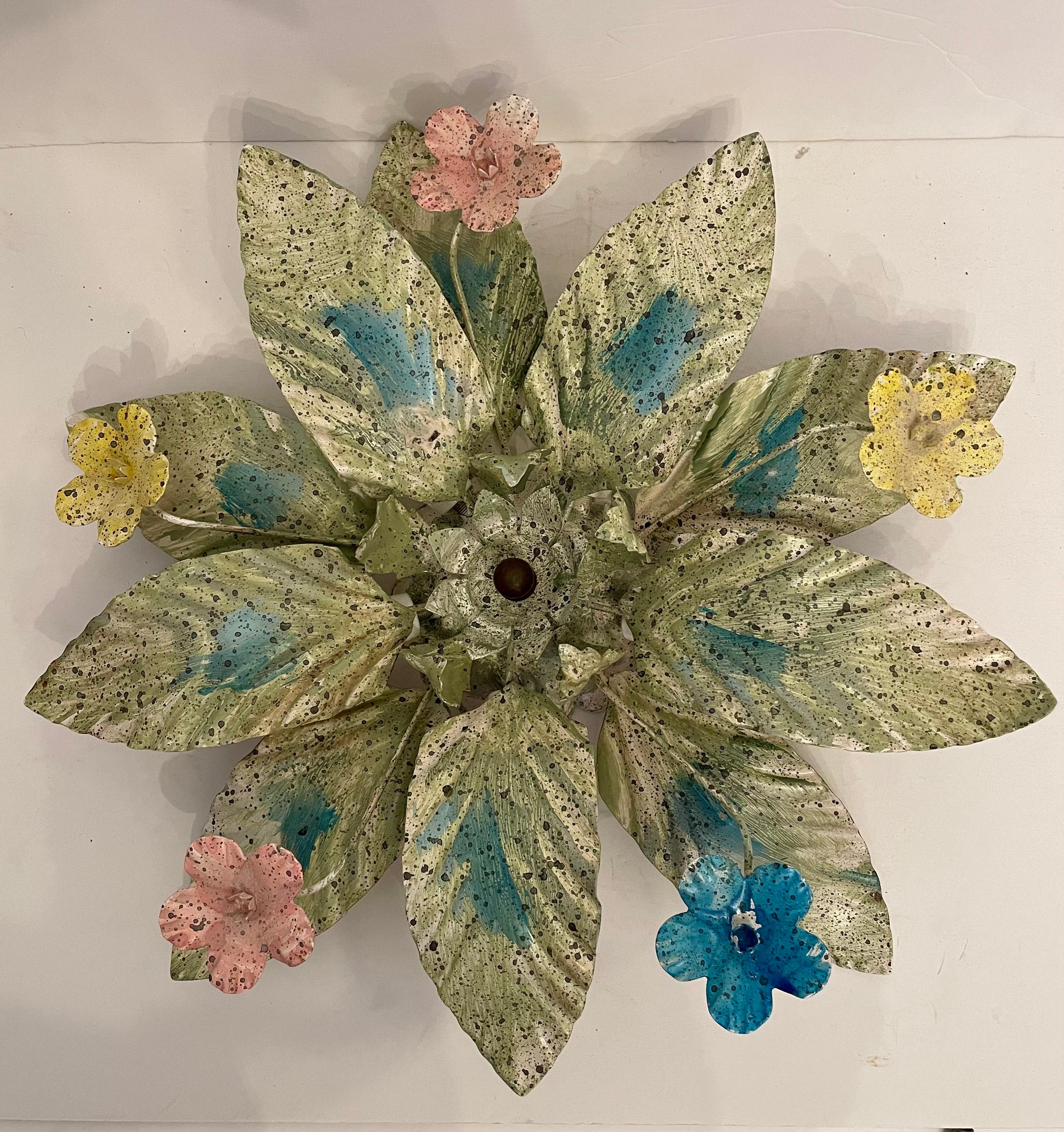 Flush mount Tole painted flower  and leaf design chandelier with Five candelabra base sockets. Painted in multiple colors with brass flower center.  Good working condition. Ready to hang and use. Measures: 18