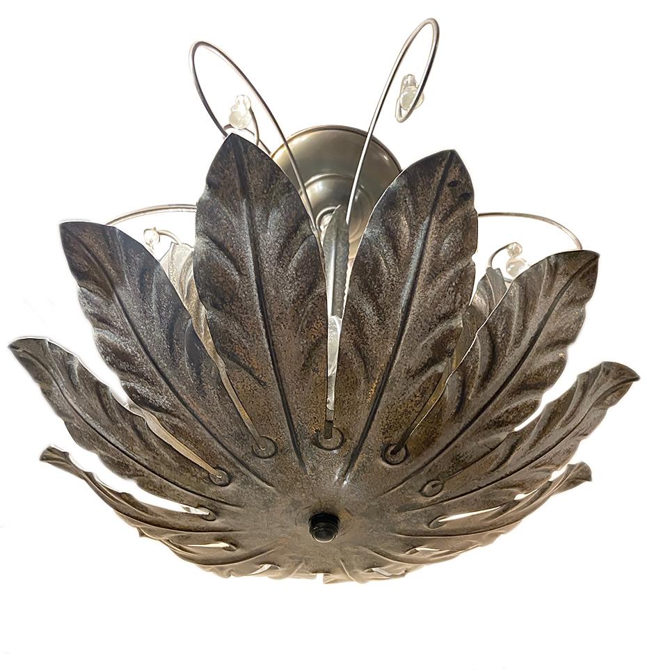 A hand painted and patinated foliage-motif metal light fixture with four interior lights.

Measurement:
Height (minimum drop) 15.5