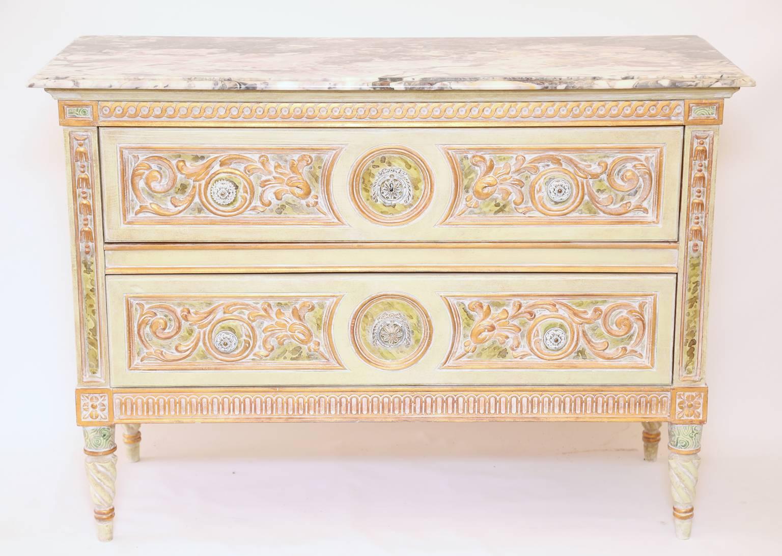 Commode, having a colorful painted finish, with a rectangular marble top, over elaborately carved case, double stack drawers decorated with scrollwork, flanked by foliate stiles, guilloche-carved apron, raised on spiral-turned, tapering legs ending