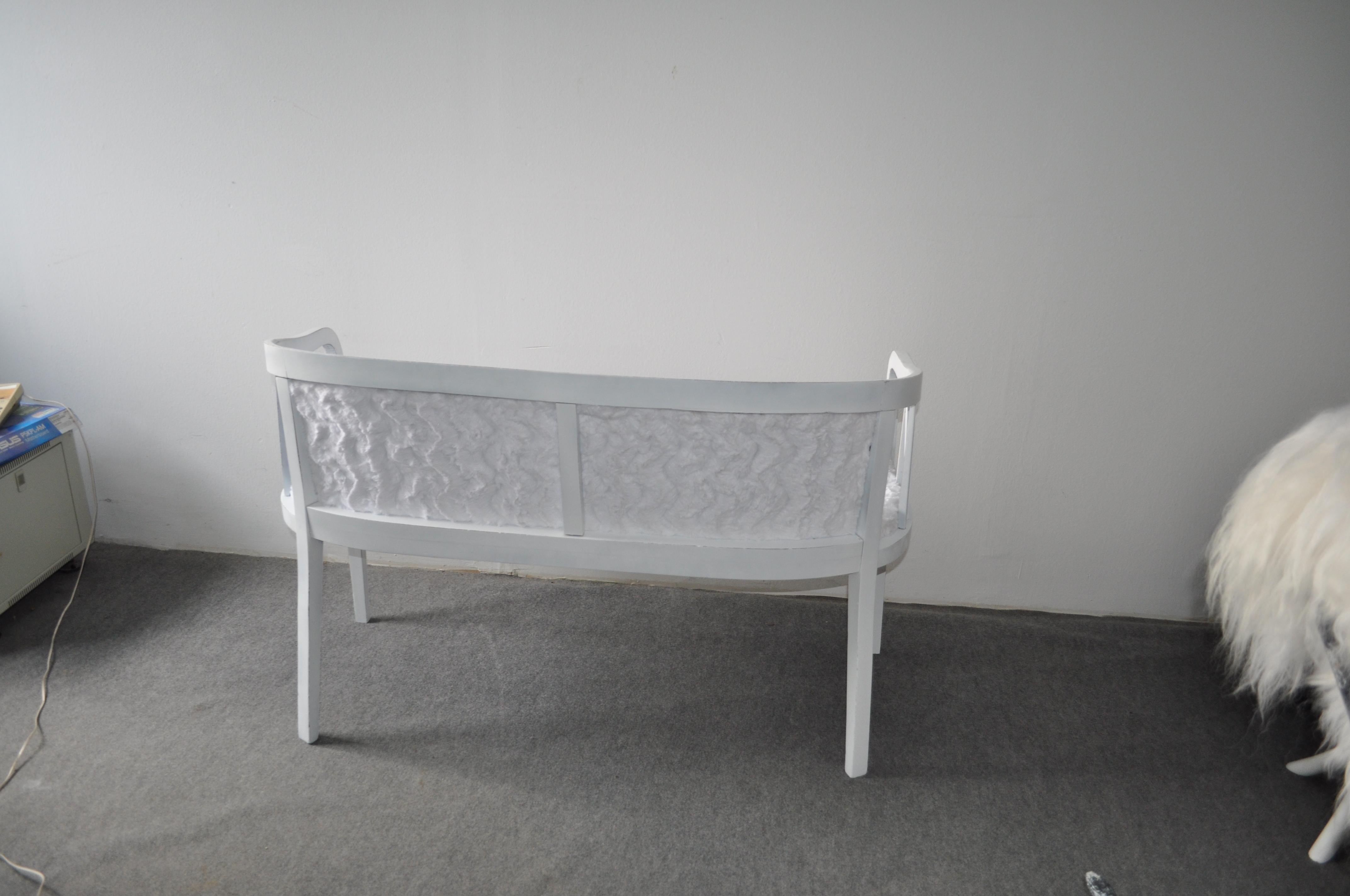 White painted sofa. Sofa was fully and professionally re-upholstered with a white colored faux fur.