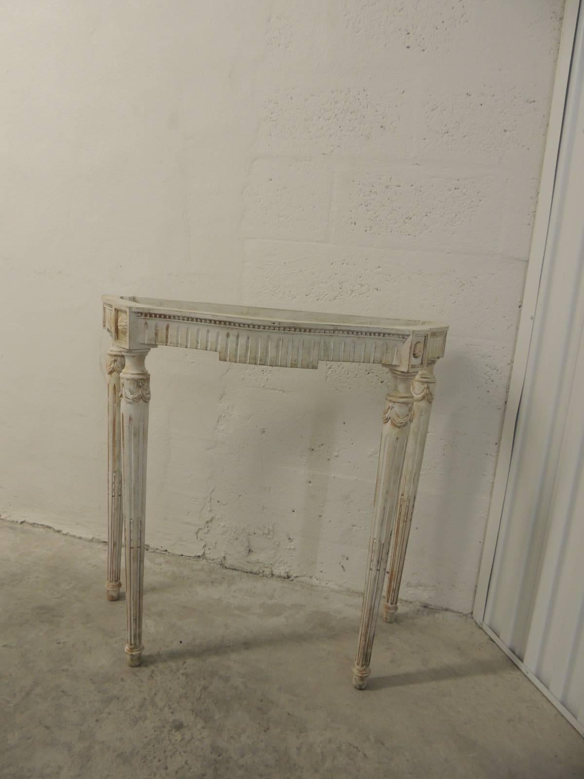 Painted white vintage consoles with fluted legs and orange undertones.
White serpentine legs vintage console with carved rosettes, fluted legs carved with garlands and ropes on the chalky painted vintage pieces legs.
Note: No top available, just the