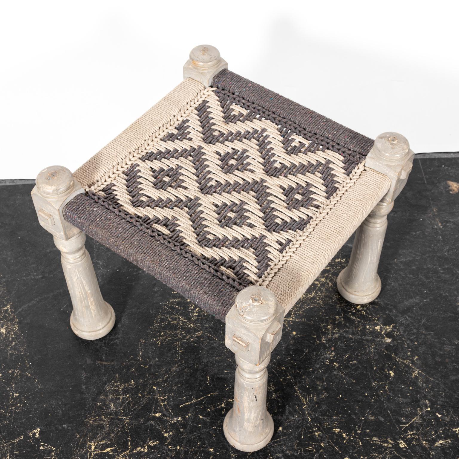 Wood and rope stool painted in grey and black. The piece also features a diamond woven pattern on the seat. Please note of wear consistent with age including paint and finish loss.