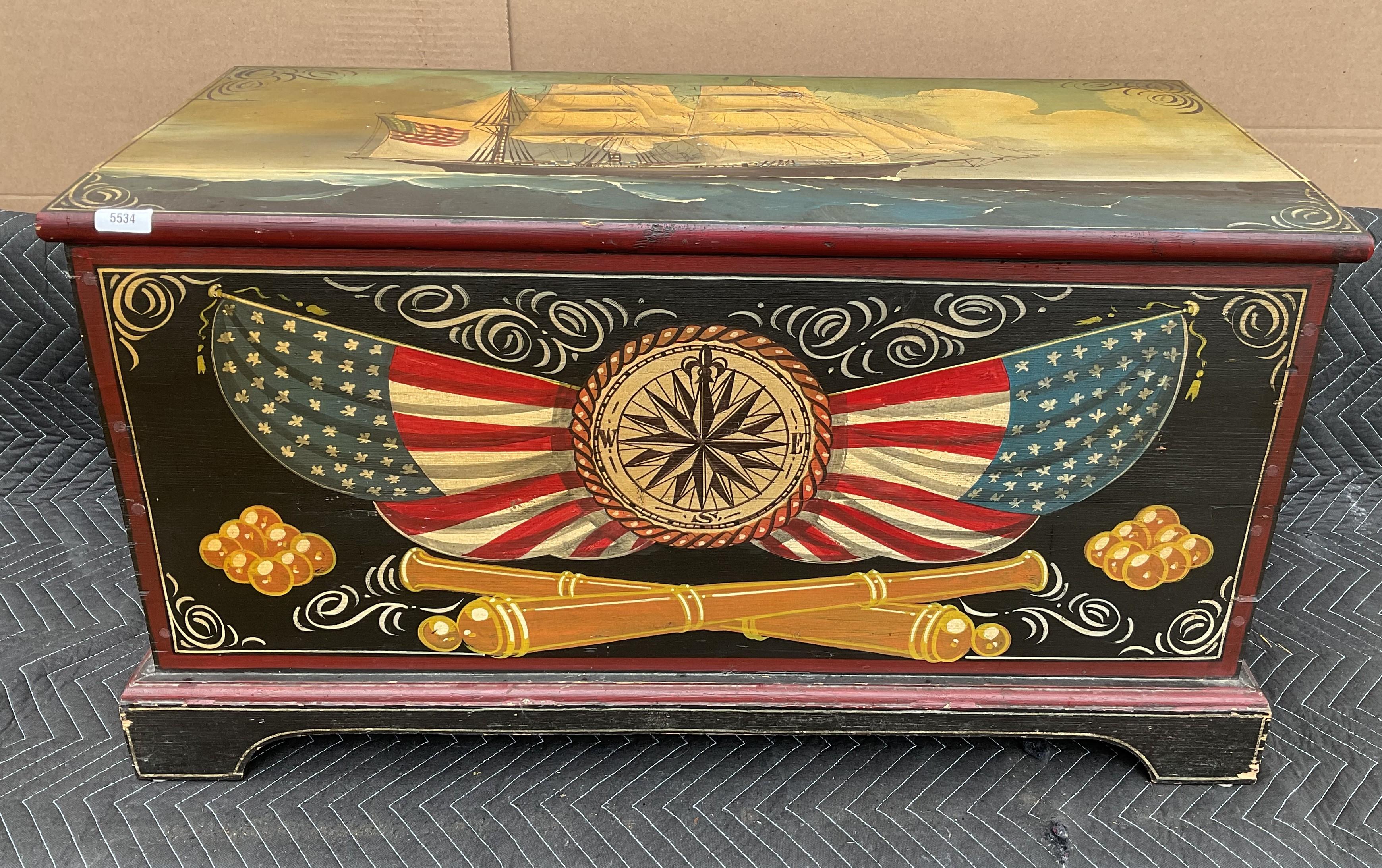 Reproduction chest with nautical decoration. Painted artwork includes cannon, flags, compass rose and a sailing ship on the hinged top. 20' H x 37