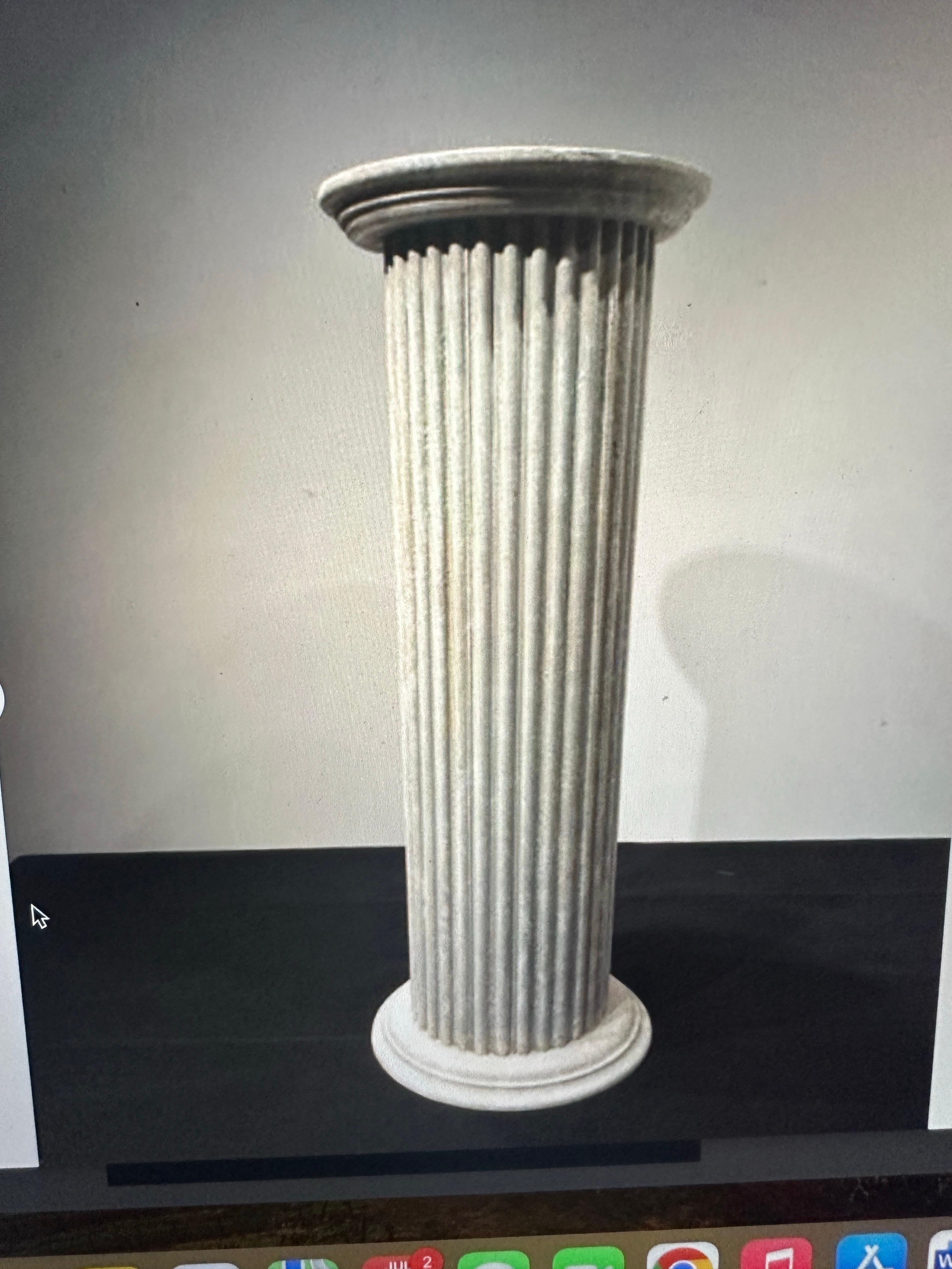 Bring a touch of classical architecture into your home with this impressive vintage column pedestal painted in a Gustavian color of grey with white showing through. Certainly a very neutral color that blends in any setting. This classic two part