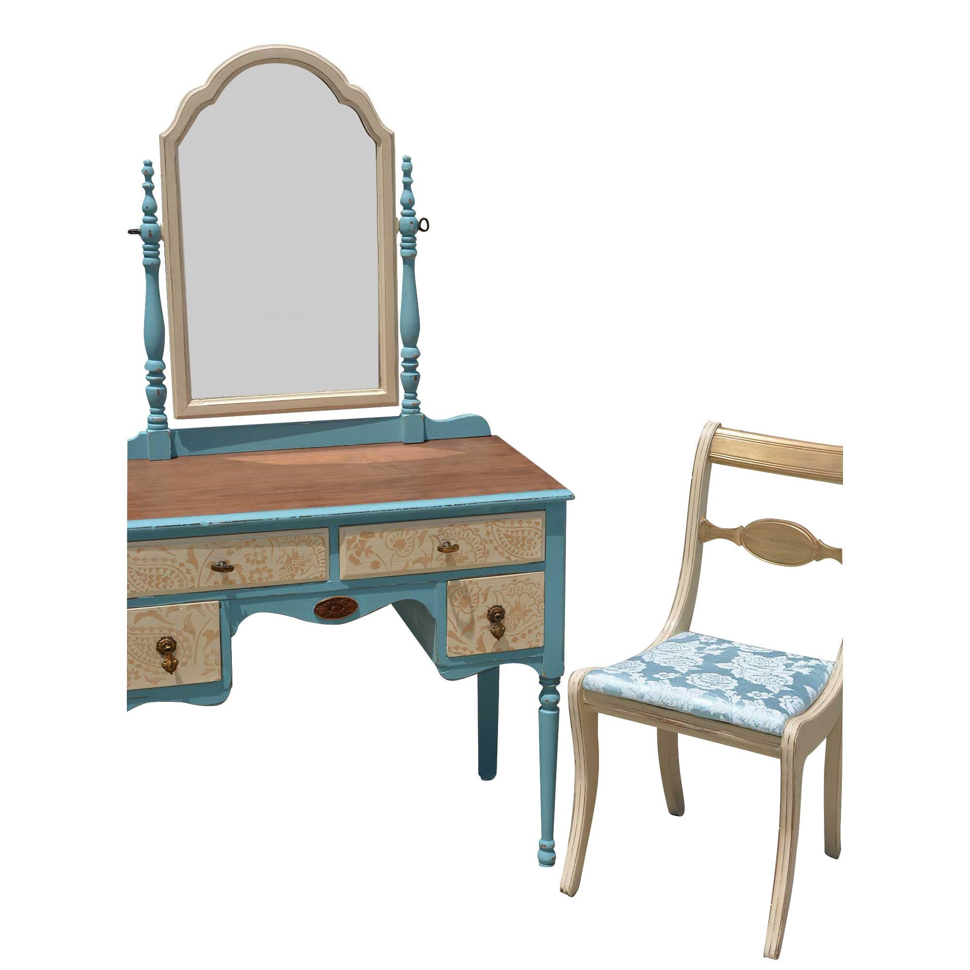 Painted vanity with large mirror has a lovely blue base with light tan and gold accents across the front. Perfect accent to any bathroom or bedroom with lots of storage room in the four drawers and large mirror that is able to tilt. The top of the