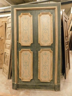 Painted wooden double-leaf door with frame, Italy