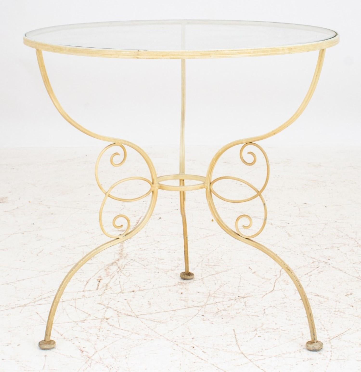 Wrought iron round side table with a glass top, painted in creme tone, with a three-leg base.

Dealer: S138XX