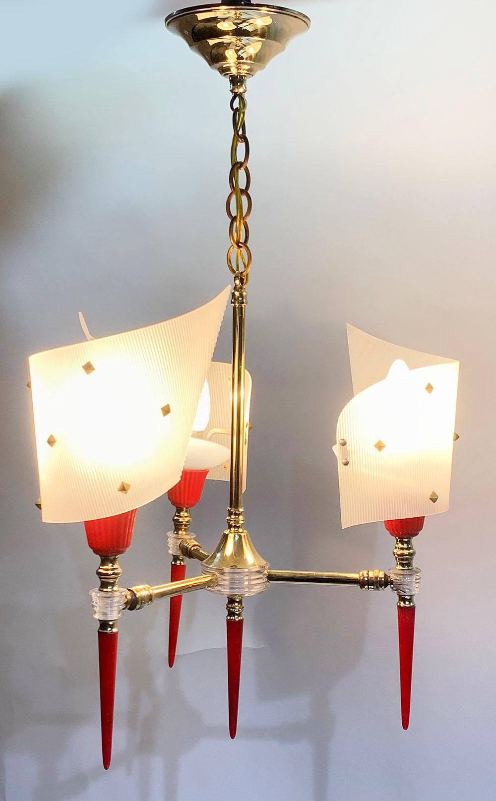 French Mid-Century Modern plastic and brass painter palette Set in Jean Pierre Guariche style 1950s 1960s 
The set consist of a pendant chandelier and 2 wall sconces.
it's shaped like a painter's palette and the red stem downwards is reminiscent