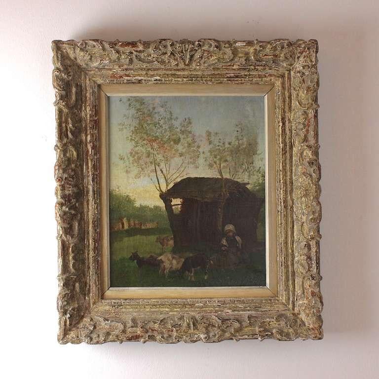 Painter School of Barbizon 19th Century Rural Scene with Peasant Girl and Goats

Evocative French rural scene in evening light showing a young girl and her dog sitting at an old shed amongst her goat herd. 
The painting is painted in oil on canvas