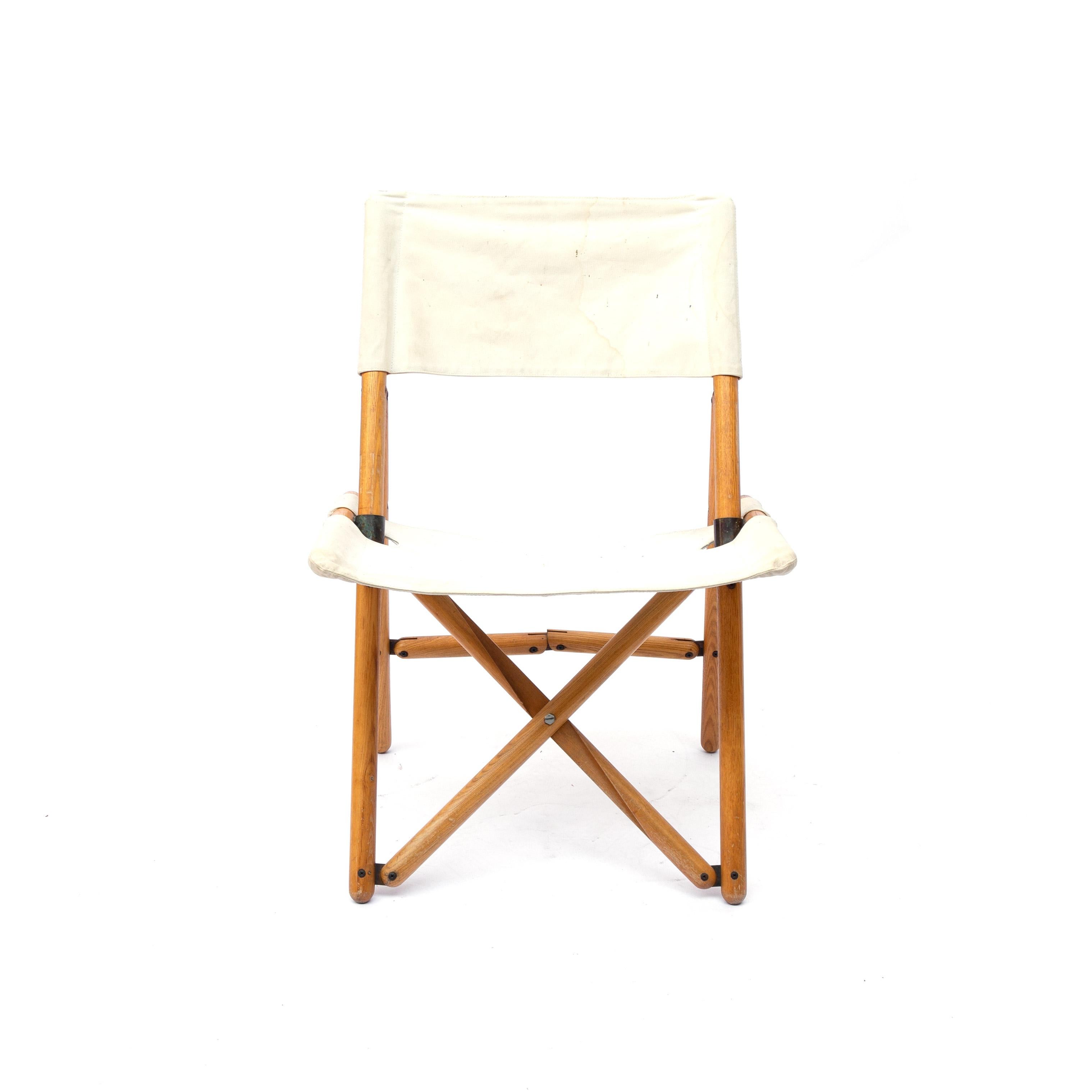 This chair is made from a beech wooden structure with metal joint and removable flax elements. It remain in a good vintage condition: wear consistent with age and use. The canvas is original from the 1960s.