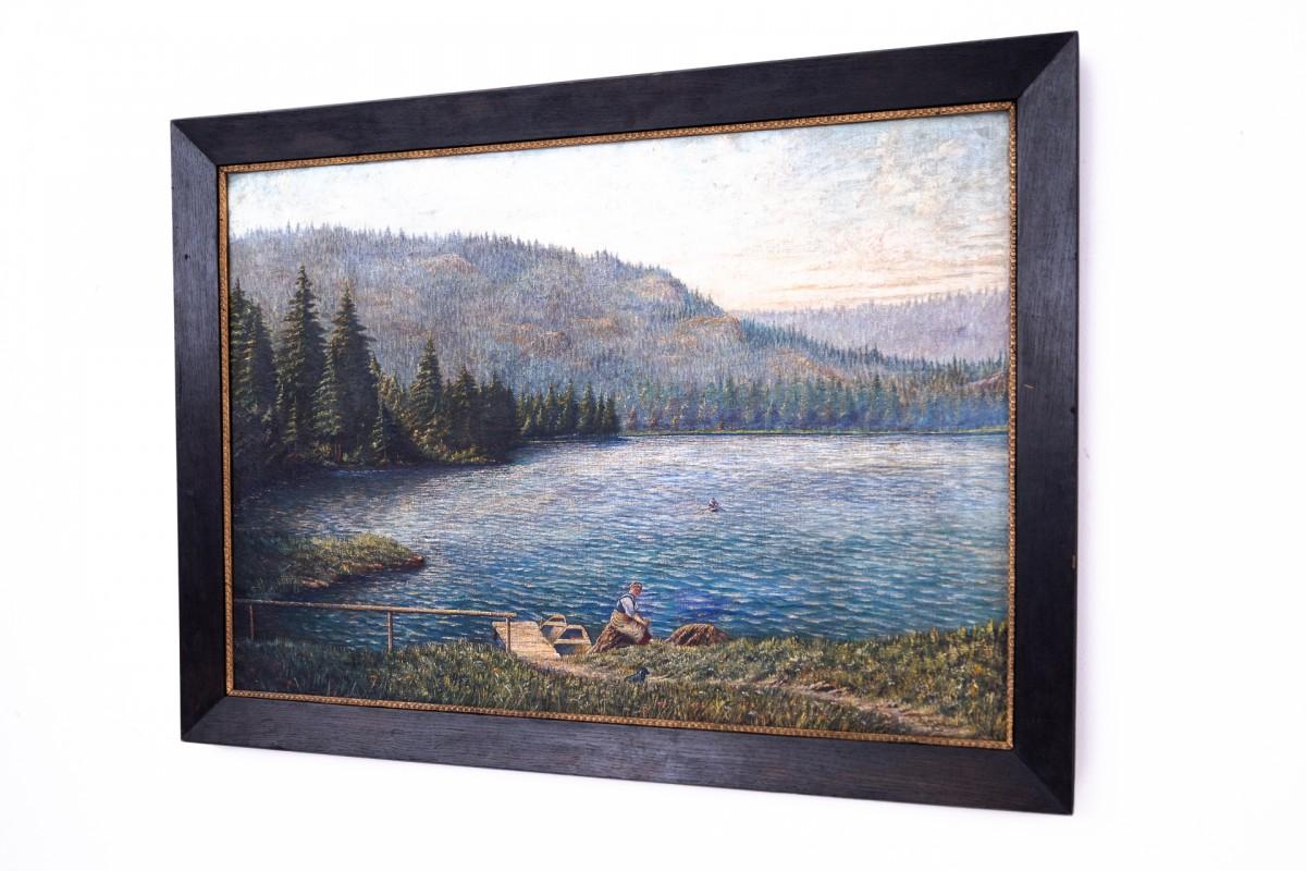 This serene oil on canvas, titled Landscape by the Lake, presents a tranquil and immersive natural scene rendered with great sensitivity and skill. The artist captures a calm lakeside setting, where light dances across the water and soft atmospheric
