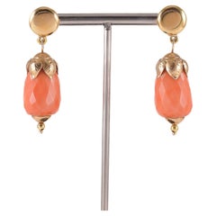 Pair of yellow gold earrings with red-orange coral