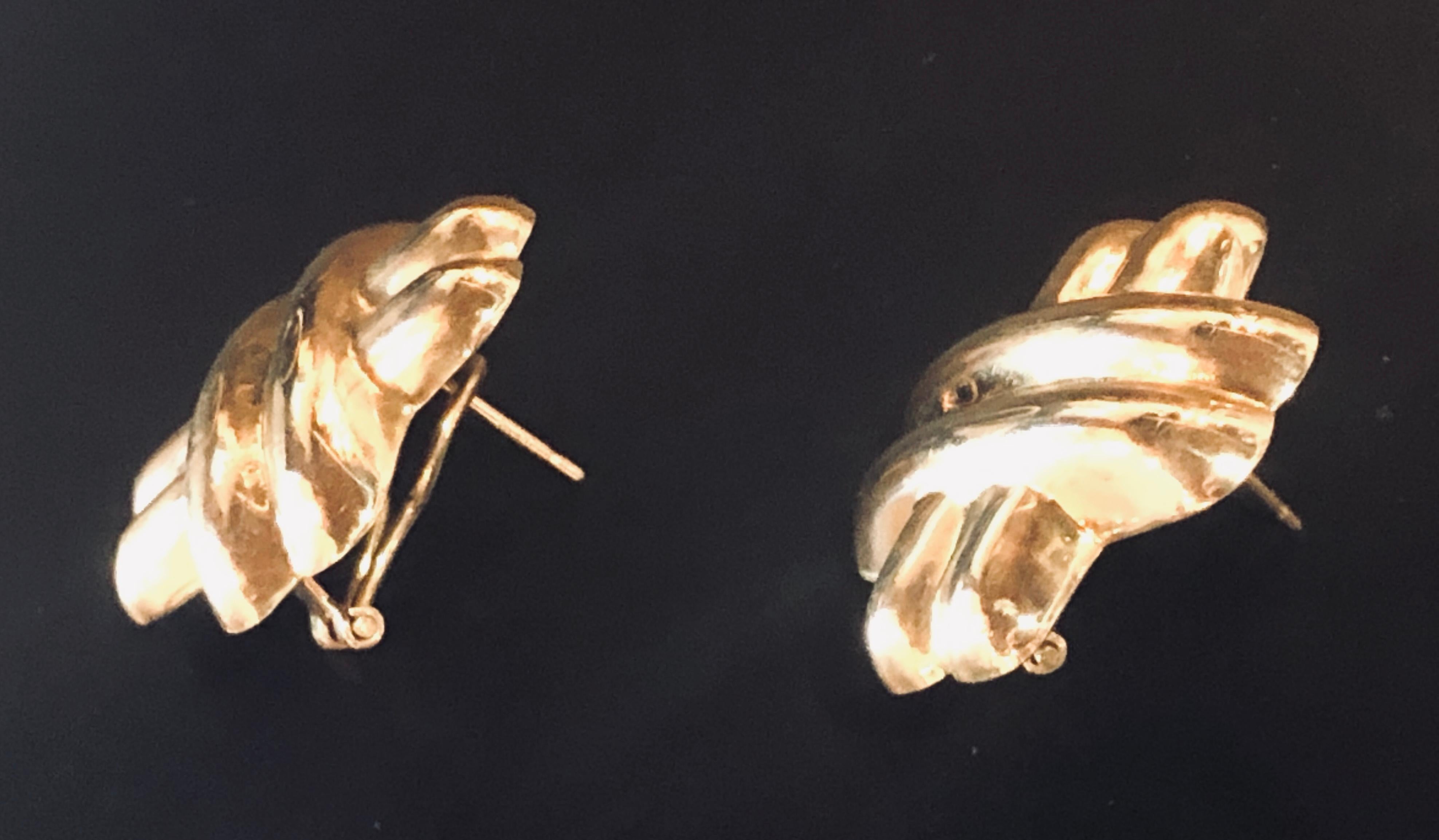 Pair 14 Karat Yellow Gold Large Criss-Cross Style Earrings. Total weight 10 grams. The dimensions are 1 inch by 1 inch with pierced clip backs.