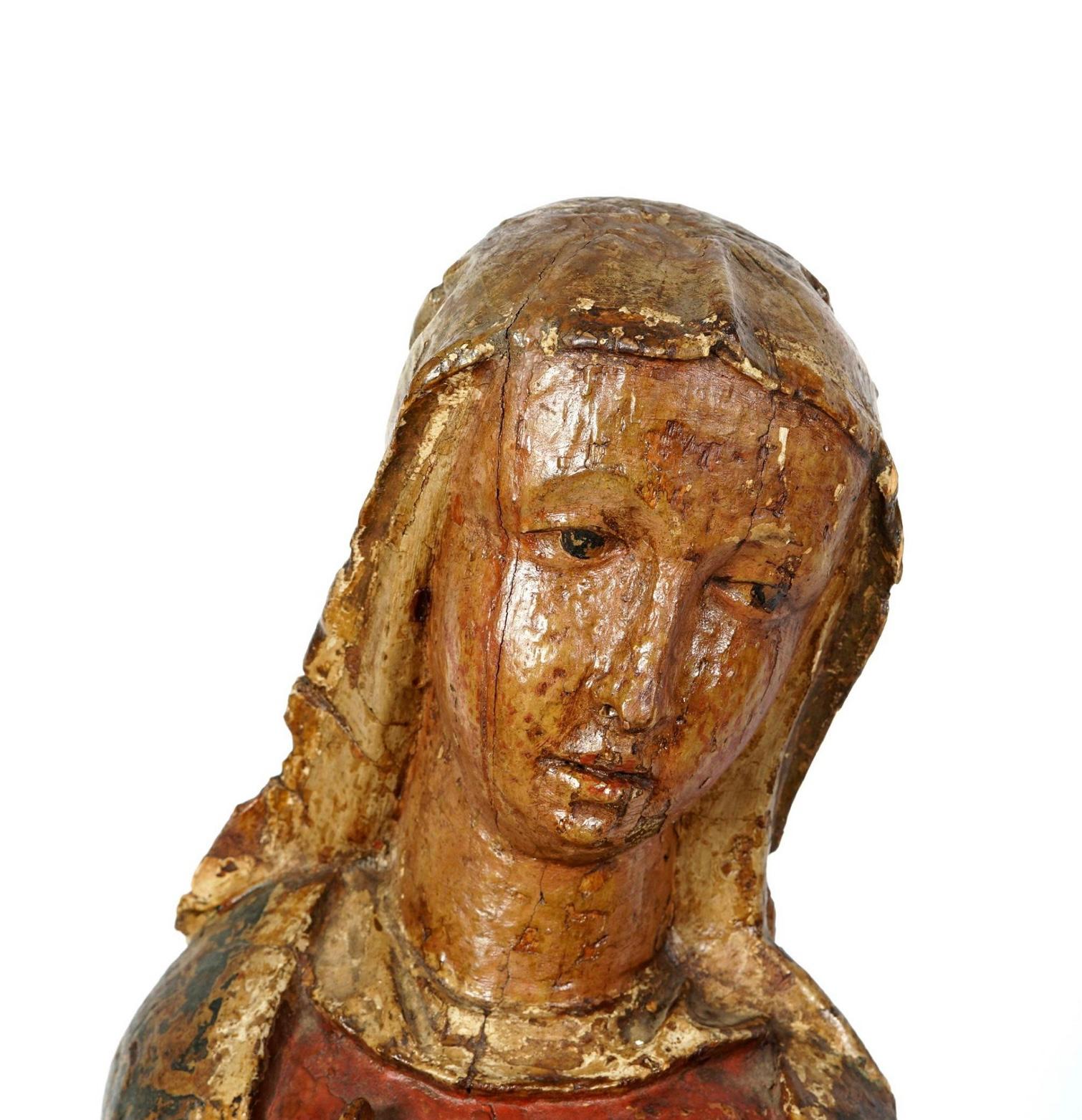 The Virgin Mary and St-John the Evangelist, from a Crucifixion. In wood with remains of polychromy. Probably Tyrol, German or Austrian. circa 1500s.
Statues in carved wood with what appears to be original polychromy finish worn to a wonderful