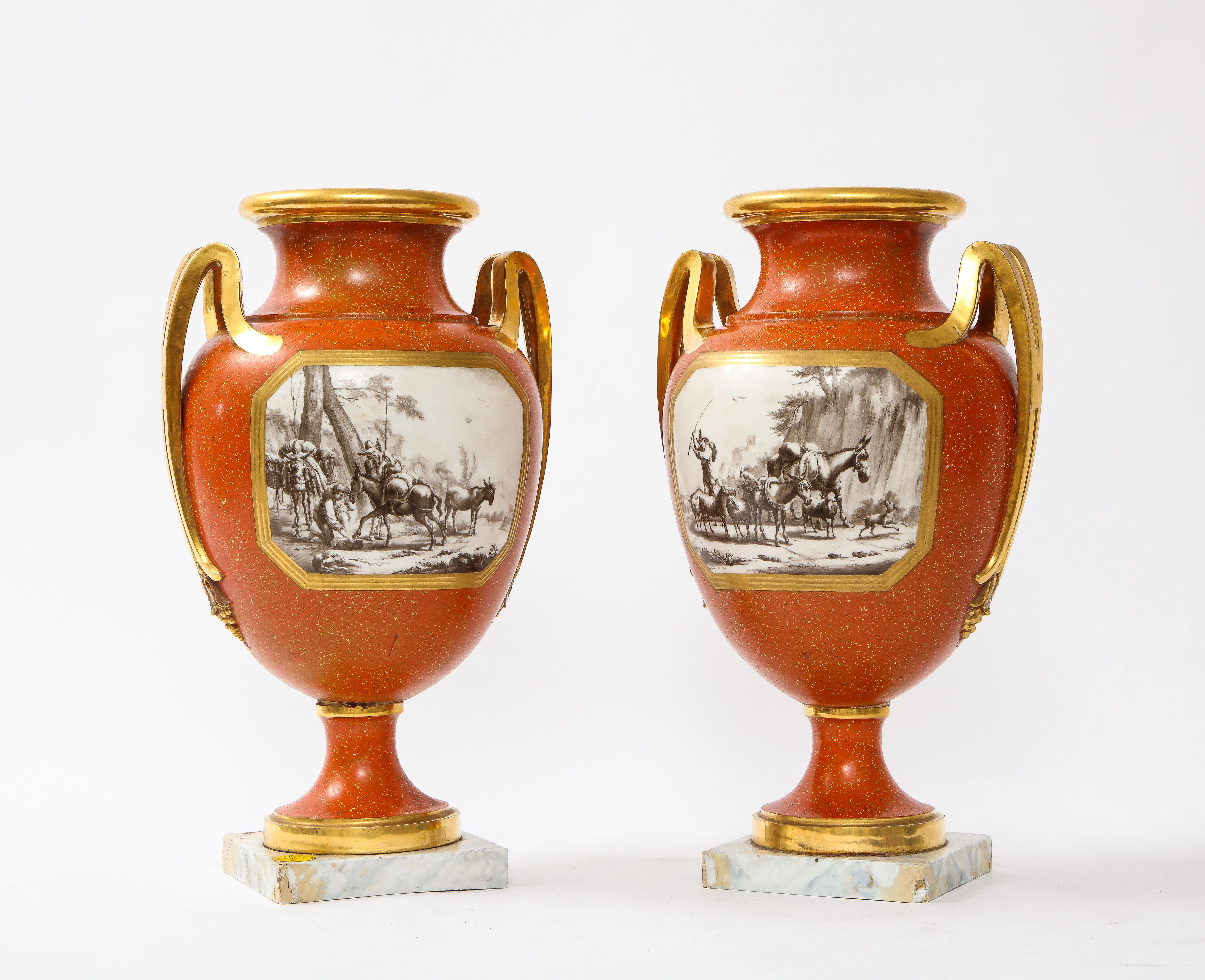 An Incredible and Very Rare Pair of 18th Century Sevres Porcelain Faux Porphyry Vases with Blue Script Sevres R.F. Marks.  Each features a classic form with flared necks and bulbous bodies that taper down to faux marble bases.  The vases depict