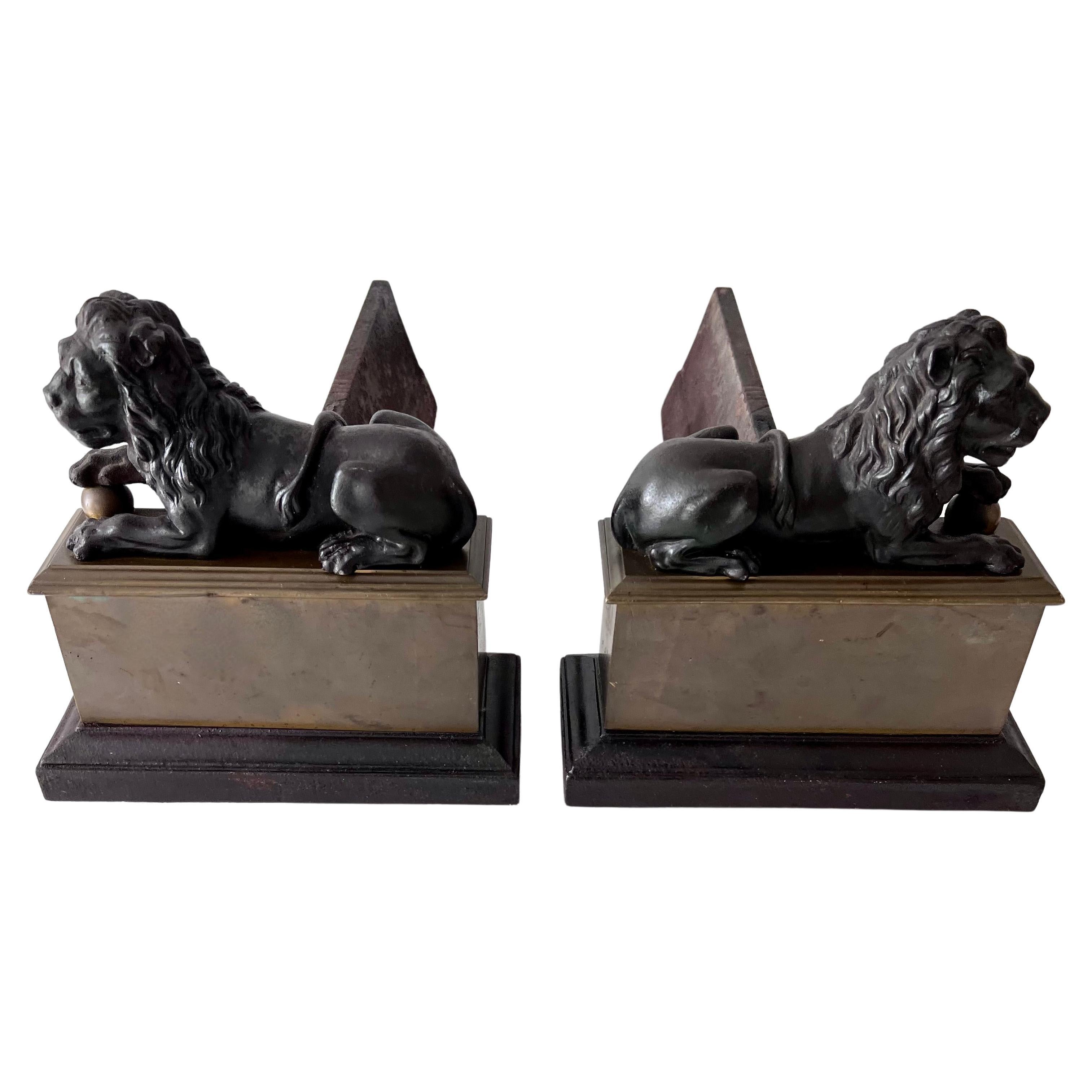 Pair 18th Century Reclining Iron Lion Andirons on a Brass Base