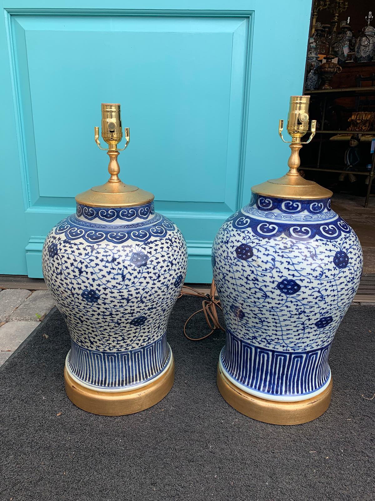 Pair of late 19th-early 20th century Chinese blue and white vases as lamps, custom giltwood bases
brand new wiring.