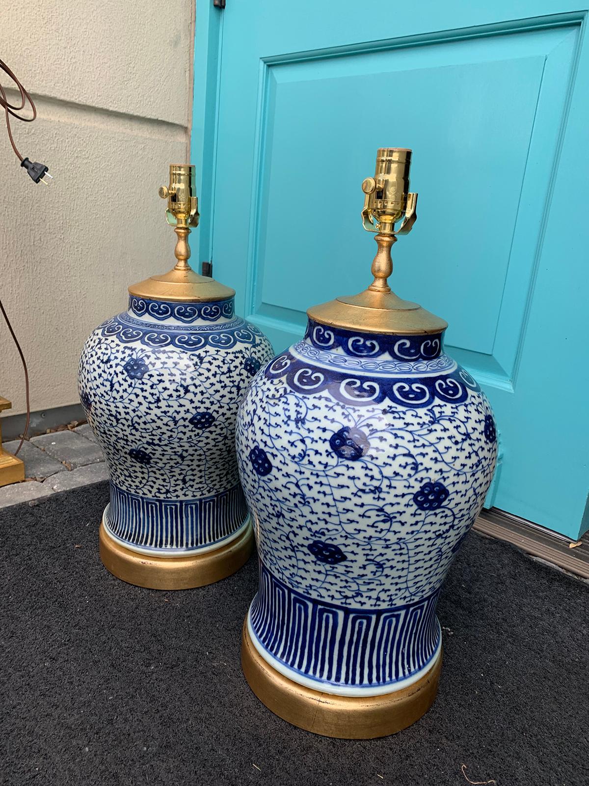 Chinese Pair of Late 19th-Early 20th Century Blue & White Vases as Lamps, Giltwood Bases