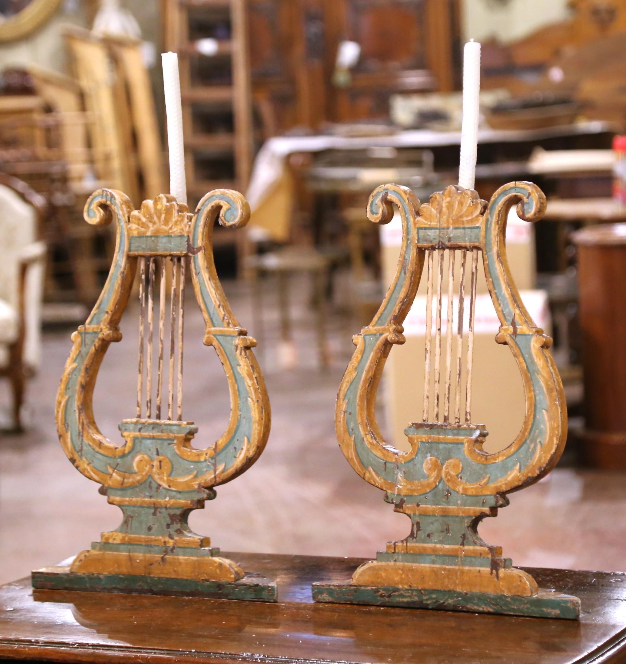 Add sculptural presence to a wall, console, or tabletop with this expressive pair of 18th-century Italian architectural ornaments, carved in the form of stylized lyres. Likely once part of a larger ecclesiastical or theatrical furnishing—such as an