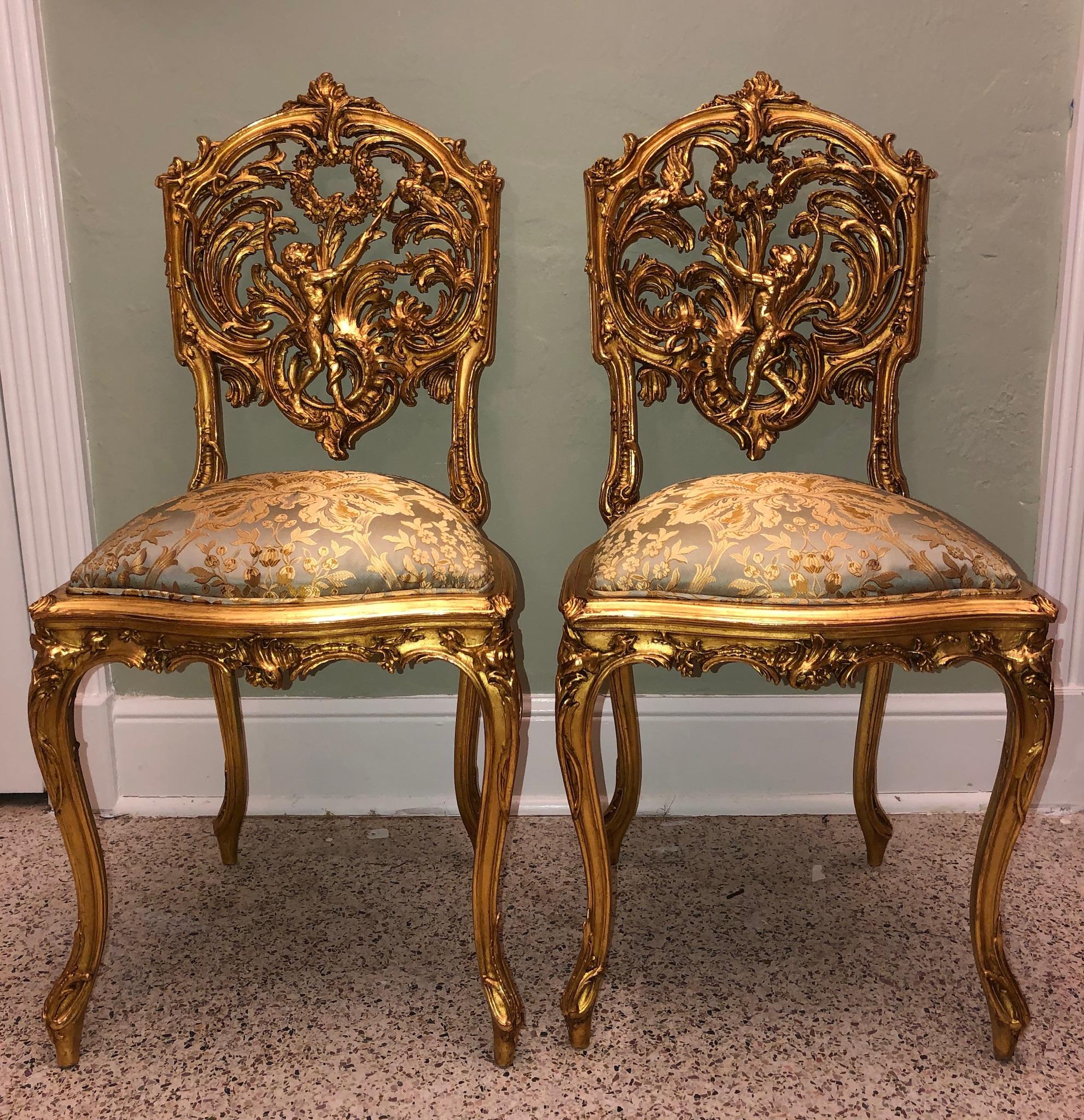 Extraordinary (true) pair of side chairs sculpted in the 18th century. The seat backs are hand carved wood , in the chinoiserie style of the period , complete with singes et oiseaux. On chair 1 is a large monkey at the center back with a peacock