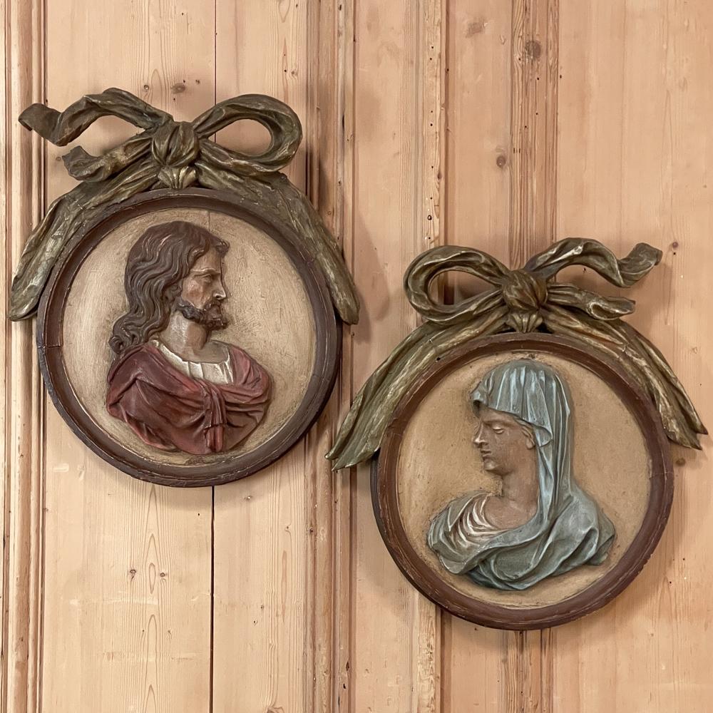 Showing the lovely patina of centuries, this stunning pair of 18th Century Carved and Painted Italian Religious Cameos of Jesus & Mary hand-carved from a solid block of old-growth yellow pine by a master sculptor. The cameo is integral with the