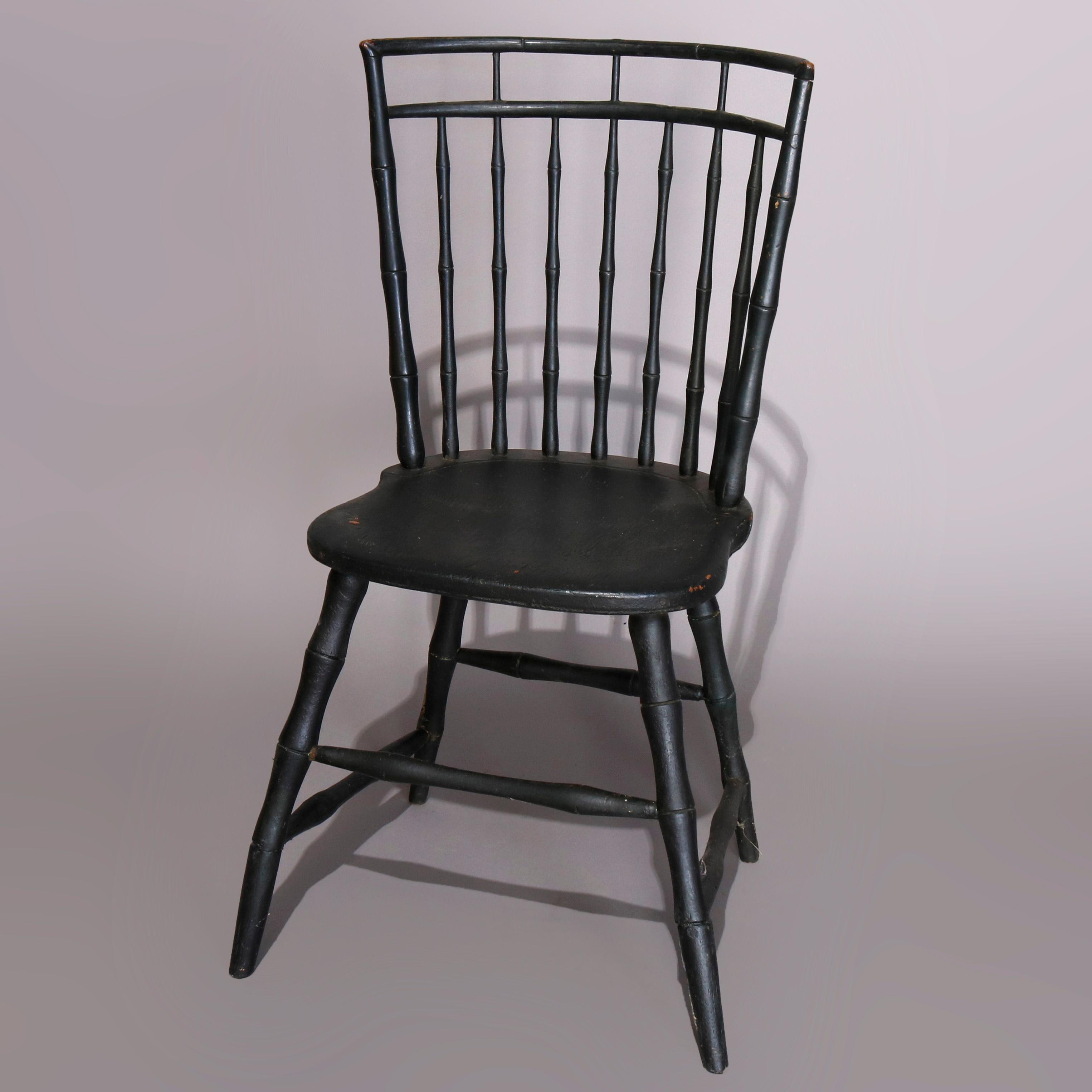 An antique pair of ebonized American Colonial Windsor chairs by James Chapman Tuttle of Salem, Massachusetts (MA) offer spindle backs over shaped seats and raised on stylized bamboo form flared legs, 18th century


Measures: 34.5