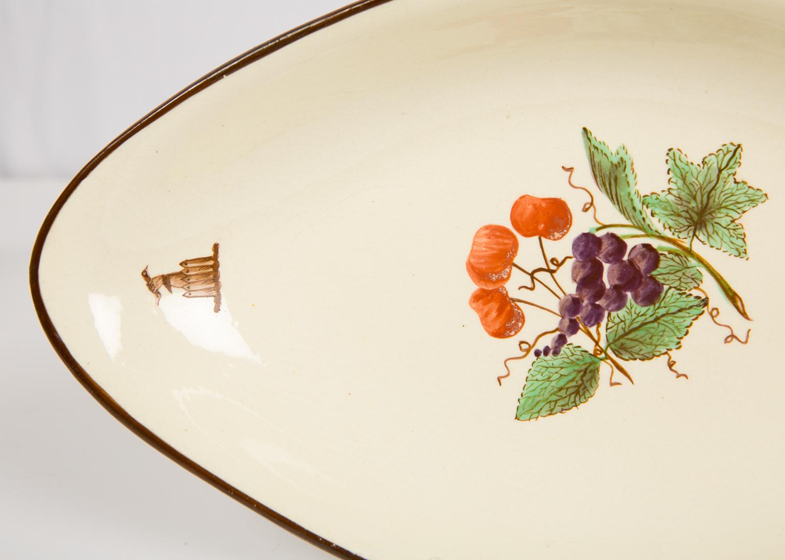 We are pleased to offer this pair of oval-shaped 18th century creamware dishes painted with lively enamels depicting fruits. Made by Turner in the last quarter of the 18th century these sweet dishes show hand-painted fruits in the centre and brown