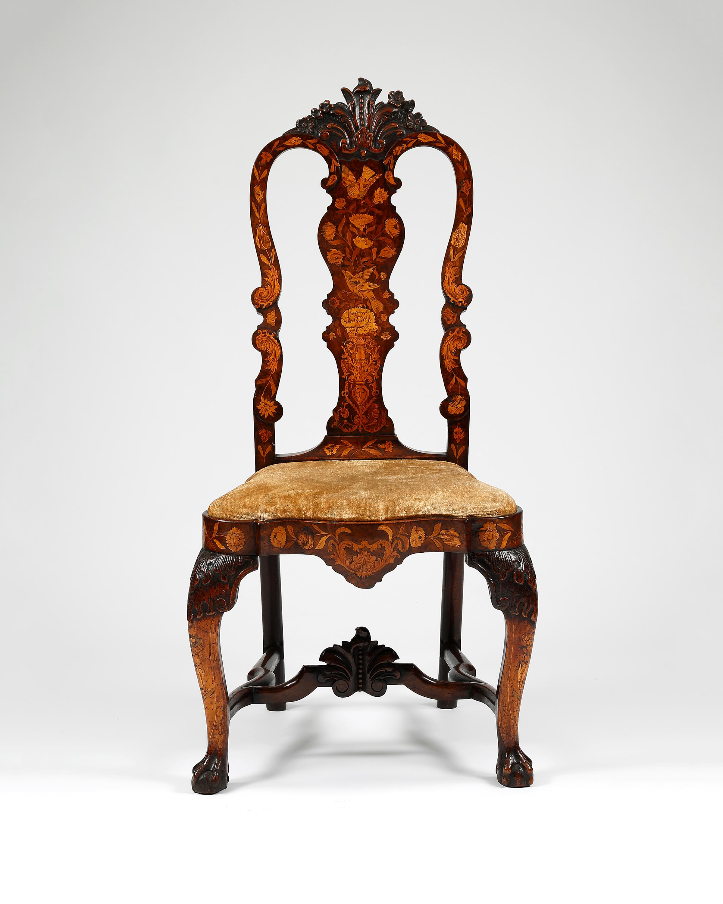 Pair of 18th century Dutch floral marquetry burr walnut chairs. Each with profuse floral inlay and solid shaped central splat headed by a fine carving of flowers and leaves. On each of the front seat rails is numbered VIII and XIII. The whole is