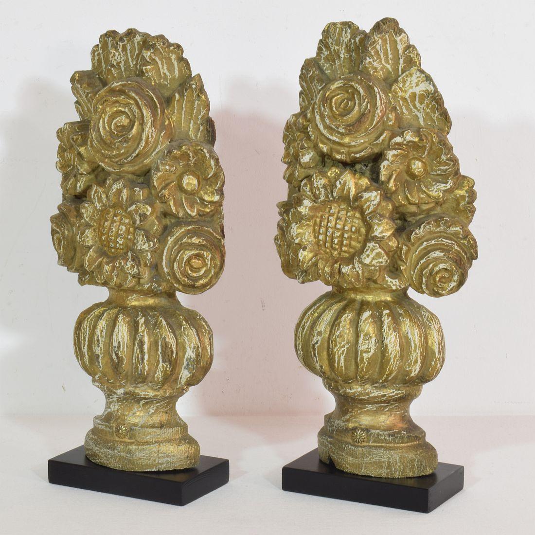 Beautiful 18th century handcarved baroque vase ornaments in a good but weathered condition.
Oak wood with old weathered paint of later date. France, circa 1700- 1750. 
Weathered, small losses and old repairs.
Measurements individual and include