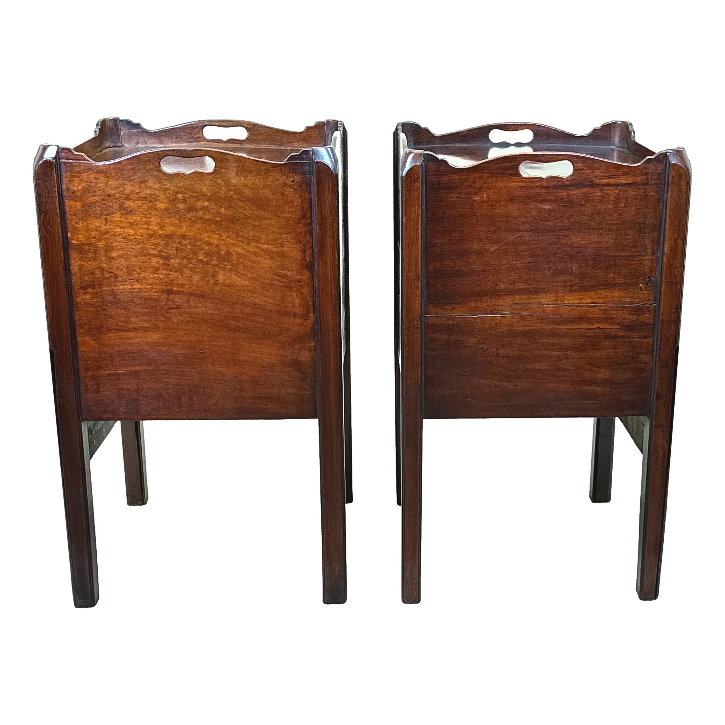 

A Good Quality And Well Matched Pair Of Late 18th Century, Mahogany, Georgian Bedside Night Tables, Or Tray Top Commodes, Having Elegant Shaped Gallery Tops Over Pair Of Well Figured Doors With Attractive Strung Decoration And Converted Pull Out