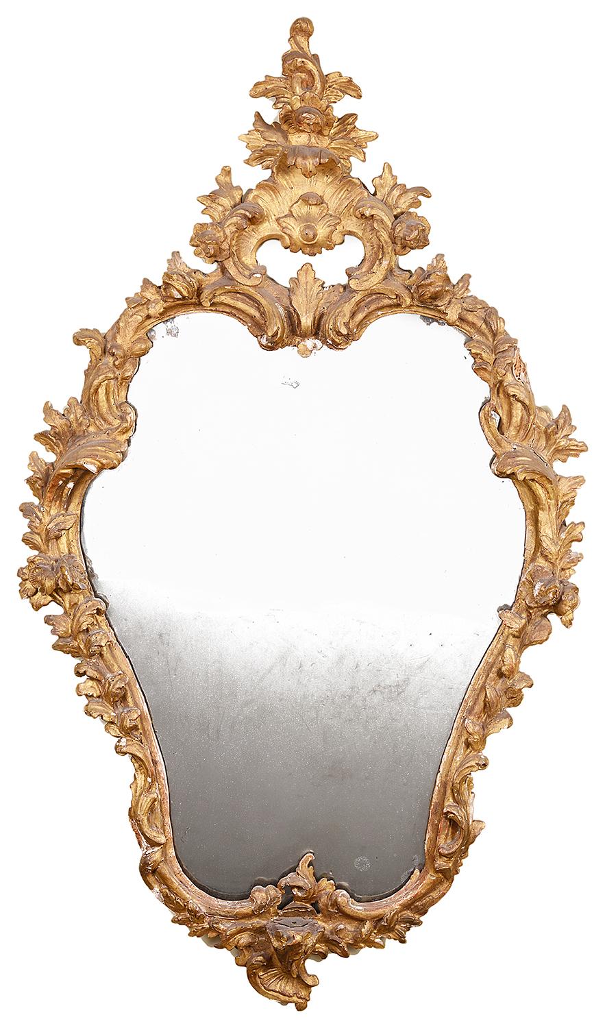 A very pleasing pair of 18th century Italian carved giltwood pier glass wall mirrors, each with carved scrolling foliate and floral decoration, both with their original mirror plates.
Measures: 94cm (37