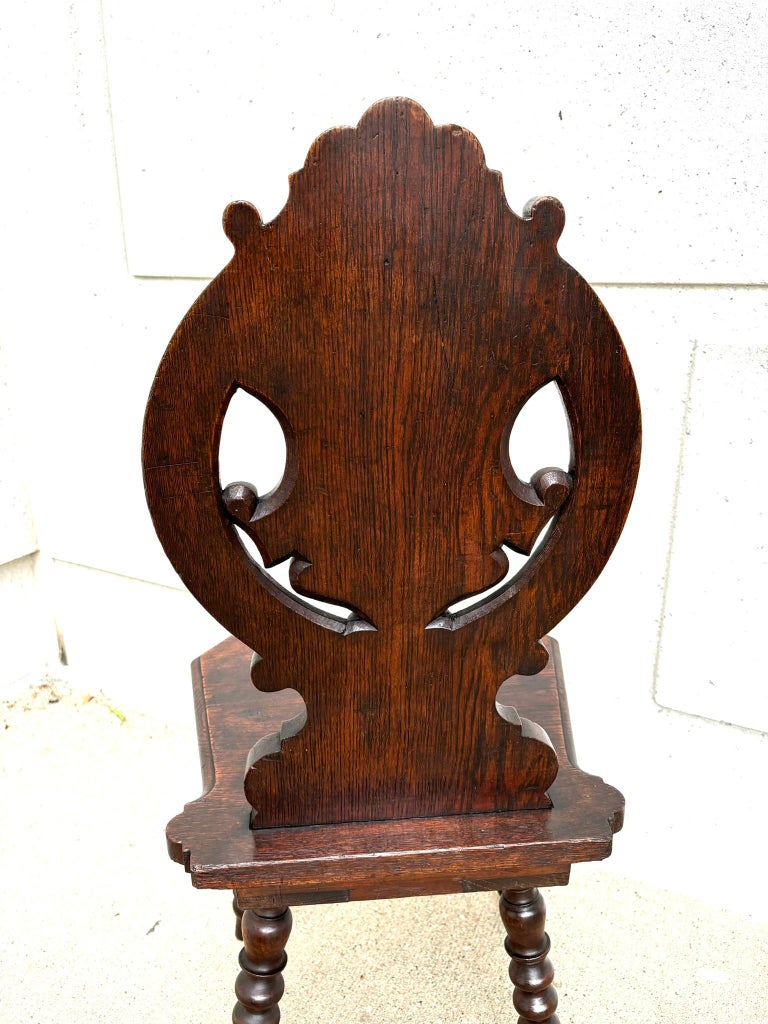 Pair 18th Century Italian Chestnut Hall Chairs Carved With Lion Crests Pair 18th Century Italian Chestnut Hall Chairs Carved With Lion Crests
