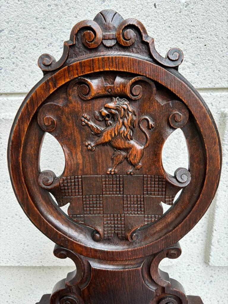 Pair 18th Century Italian Chestnut Hall Chairs Carved With Lion Crests Pair 18th Century Italian Chestnut Hall Chairs Carved With Lion Crests